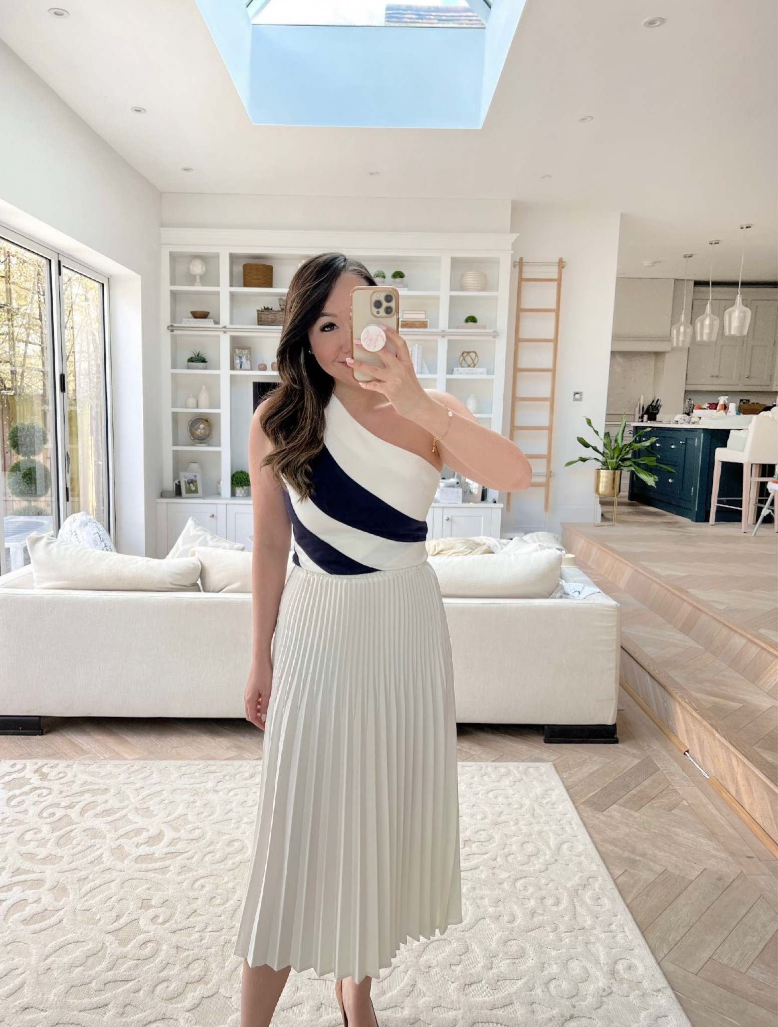 Spring style, spring outfit inspiration, summer style, chic style, monochrome colour block top, pleated cream skirt, Karen Millen, Mytheresa, Net-a-porter

#LTKstyletip #LTKSeasonal #LTKeurope