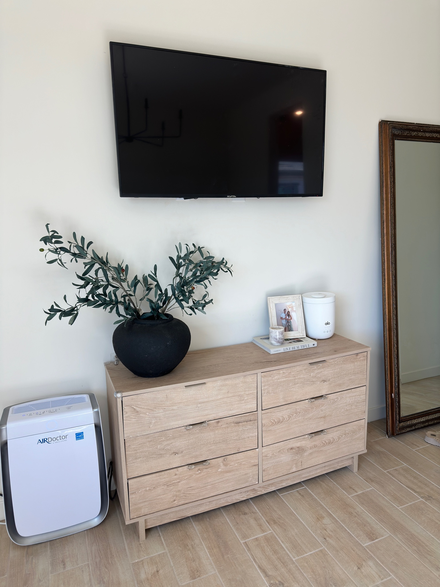 Light wood dresser and found some super similar for $325!!! I also got this dresser from wayfair but it’s old and sold out! We love our air doctor air purifier, I also got this alo diffuser for Christmas and love it! Linked black terracotta vase with olive branches as well! 🤍 

#LTKhome