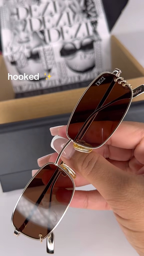 DEZI HOOKED Sunglasses in Gold – The Ultimate Shades for a Tropical Vacation & Summer Glam ✨

Obsessed is an understatement! The DEZI HOOKED sunglasses in Gold/Cognac are serving luxury with a soft rectangle wire frame and bold gold rings for that jewelry-inspired touch. Chic, unique, and perfect for leveling up any outfit while keeping your eyes protected with 100% UVA/UVB coverage. These shades aren’t just a vibe—they’re a whole statement. ✨😎 #DEZIEyewear #StayHooked #GoldSunglasses #SummerStyle #SunglassesTrend  

#LTKSeasonal #LTKFindsUnder100 #LTKStyleTip