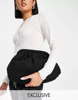 Glamorous Exclusive oversized slouchy pillow clutch bag in black teddy | ASOS (Global)