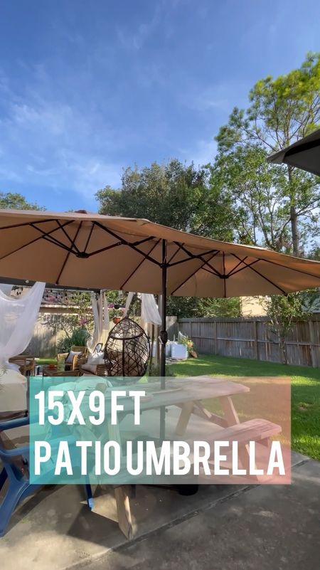 Shade in the backyard is a luxury in Texas. If there’s anything that’s quick and easy to put up and get your yard summer ready, this is it!  This extra large, 15 x 9’ patio umbrella does the trick.  It’s HUGE, like a triple sized market patio umbrella providing ample shade, even greater shade cover than the backyard pergola we previously built and 1000x faster and easier to put together. 

Simply anchor the base in a patio table- we used a hole cutter to put this through the middle of our picnic table. When not in use, simply wind it down and put a cover over it (optional). 

#LTKhome #LTKSeasonal #LTKfamily