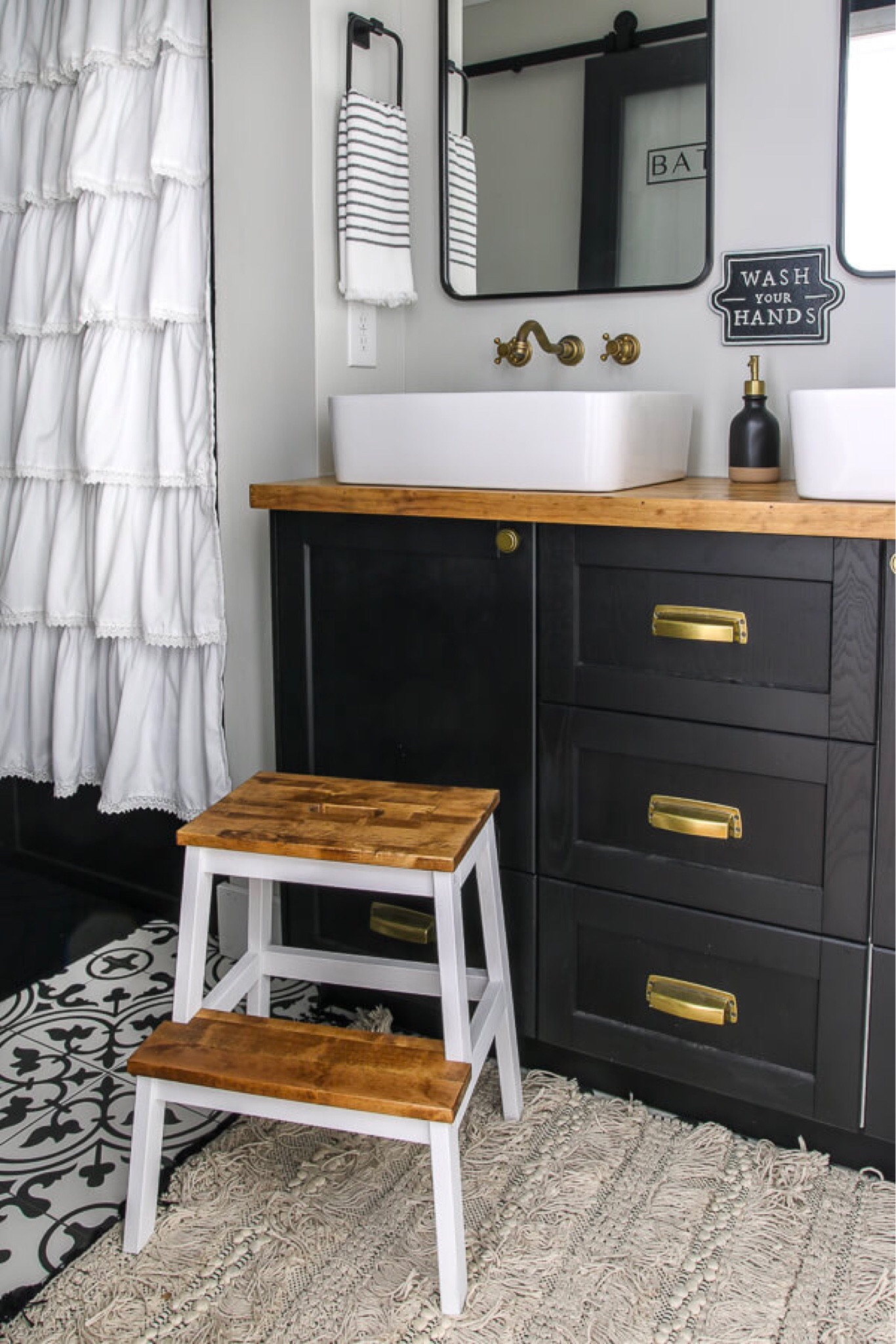 The after shot of our bathroom renovation adventures! I love how sleek and modern this looks and is a much improved version of our old bathroom.

Bathroom Renovation | Bathroom Sink |  Bathroom Mirror | Black Bathroom Mirror | Bathroom Vanity Mirror | Bathroom Decor | Bathroom Storage | Bathroom Lighting 

#LTKfamily #LTKbaby #LTKhome
