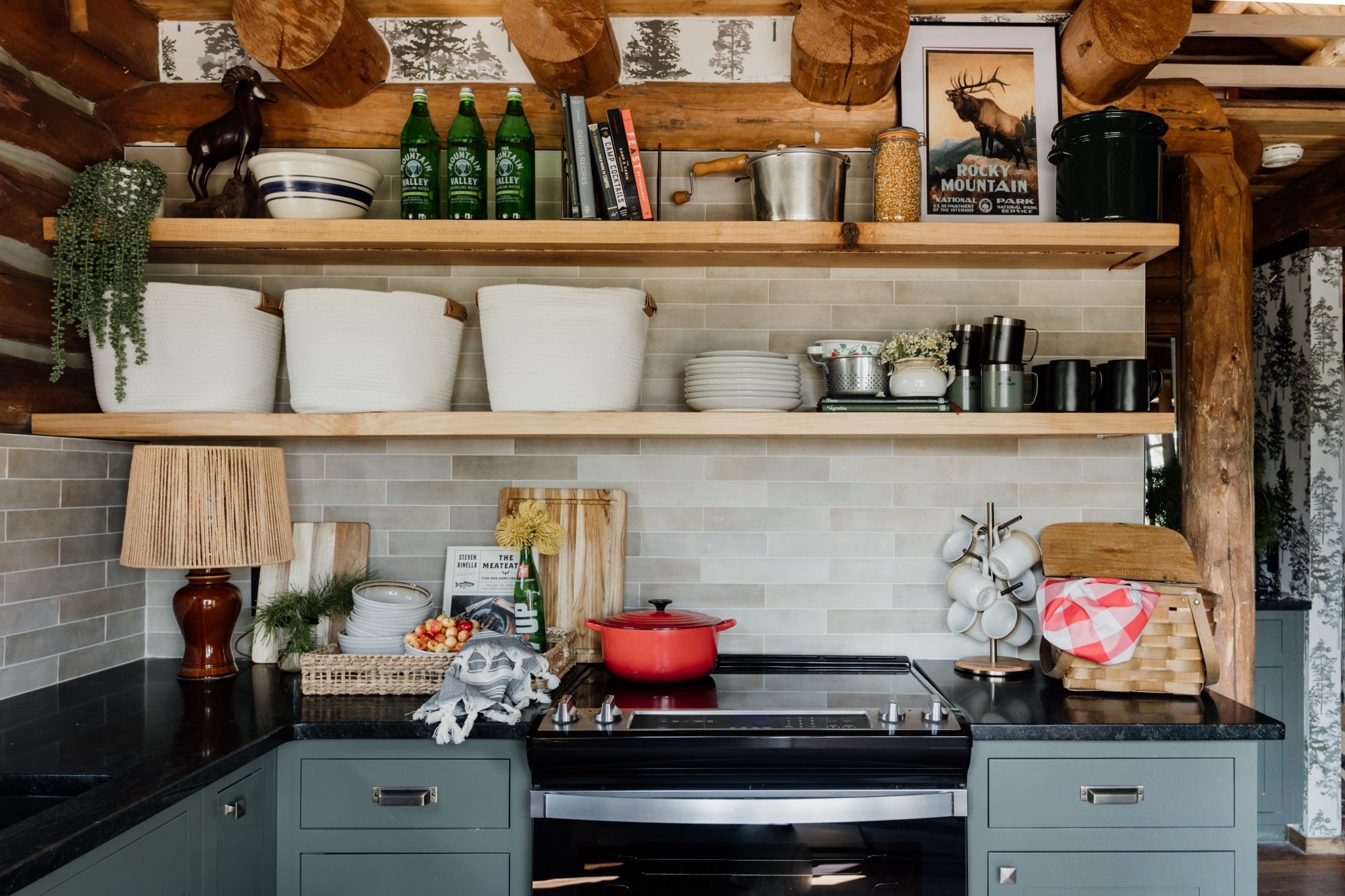 Cozy cabin kitchen shelf styling. Mixed hidden storage  (using rope baskets) with everyday vintage dishes and some fun camping themed cookbooks for added style!

Cabin Style | Green Kitchen | Shelf Styling

#LTKHome #LTKFindsUnder50