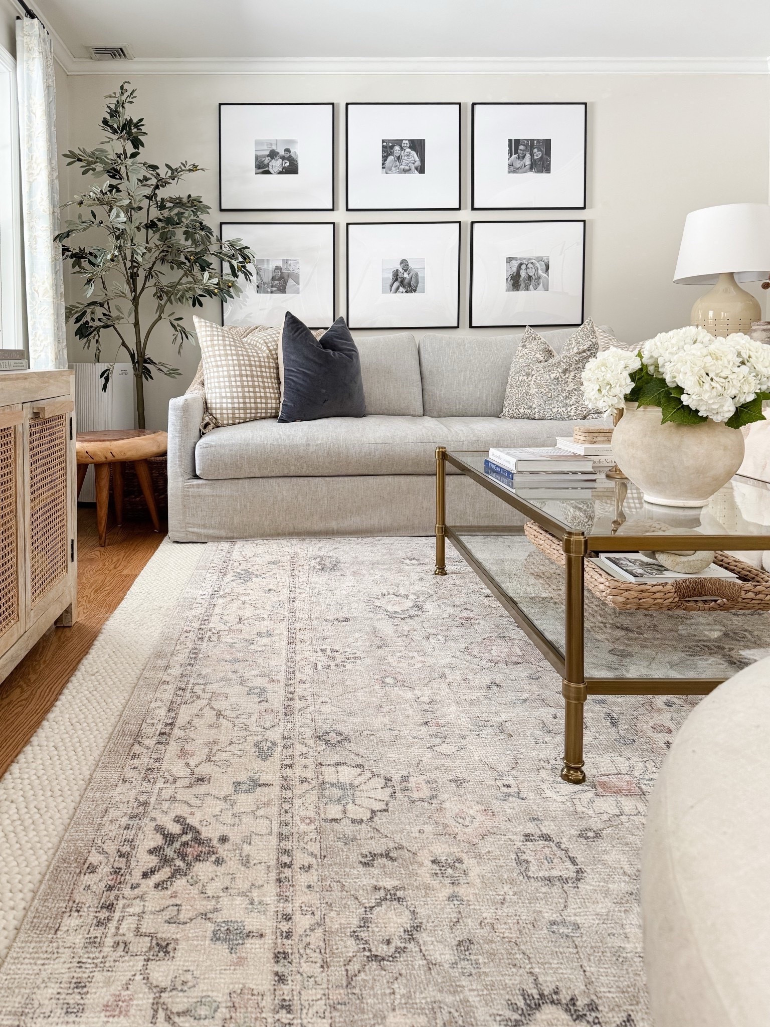 Coastal living room styled with neutral throw pillows, textured ivory rug, faux florals, and layered sofas for a relaxed high end coastal look.

coastal living room decor, neutral throw pillows, textured ivory rug, faux floral decor, layered living room styling, coastal home decor, neutral sofa styling, coffee table florals, light coastal interiors, sherricalnanhome

#LTKHome