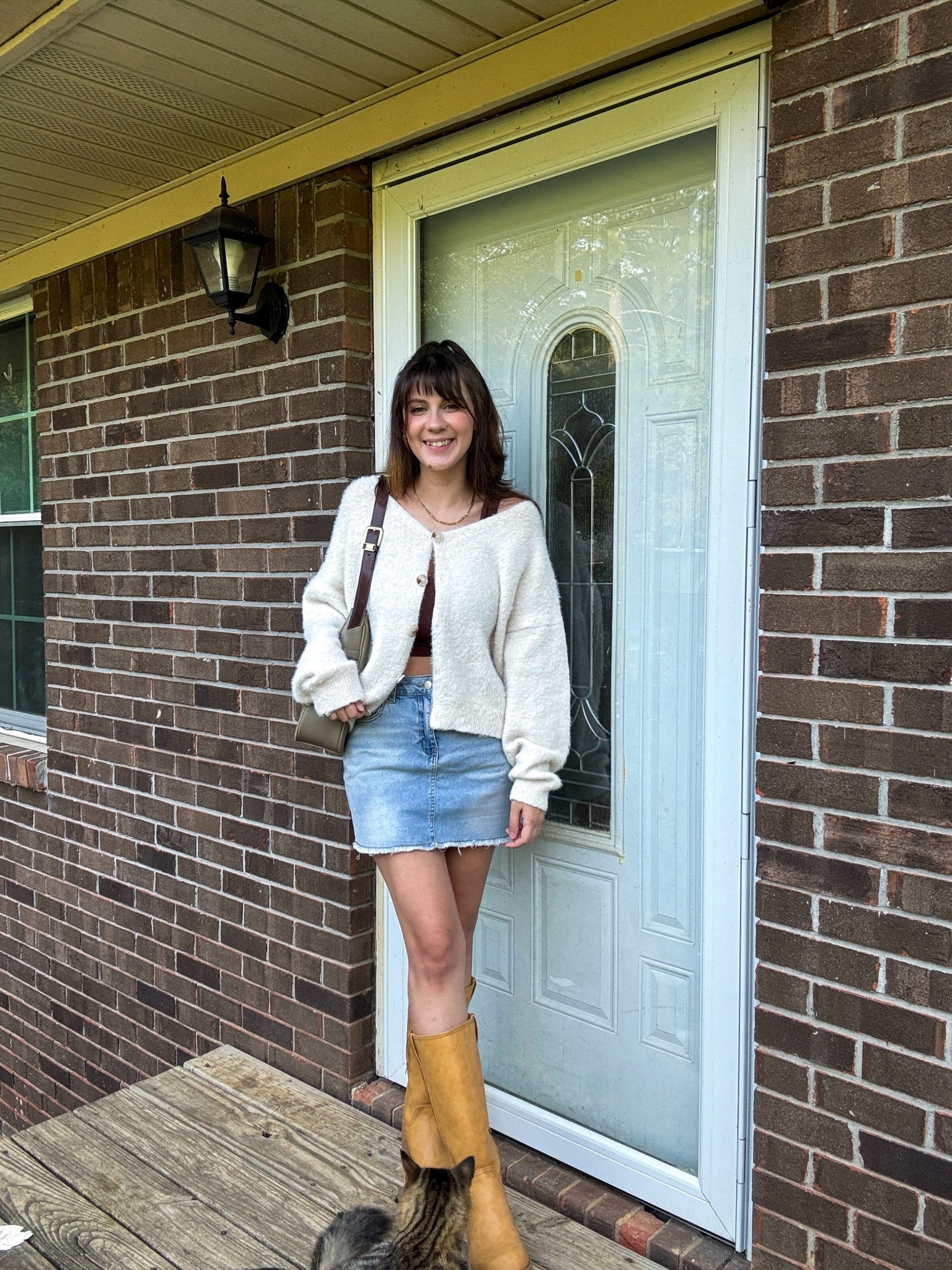 Summer to early fall transitional outfit with a denim skirt, boots, and a cardigan! 

#LTKShoeCrush #LTKSeasonal #LTKStyleTip