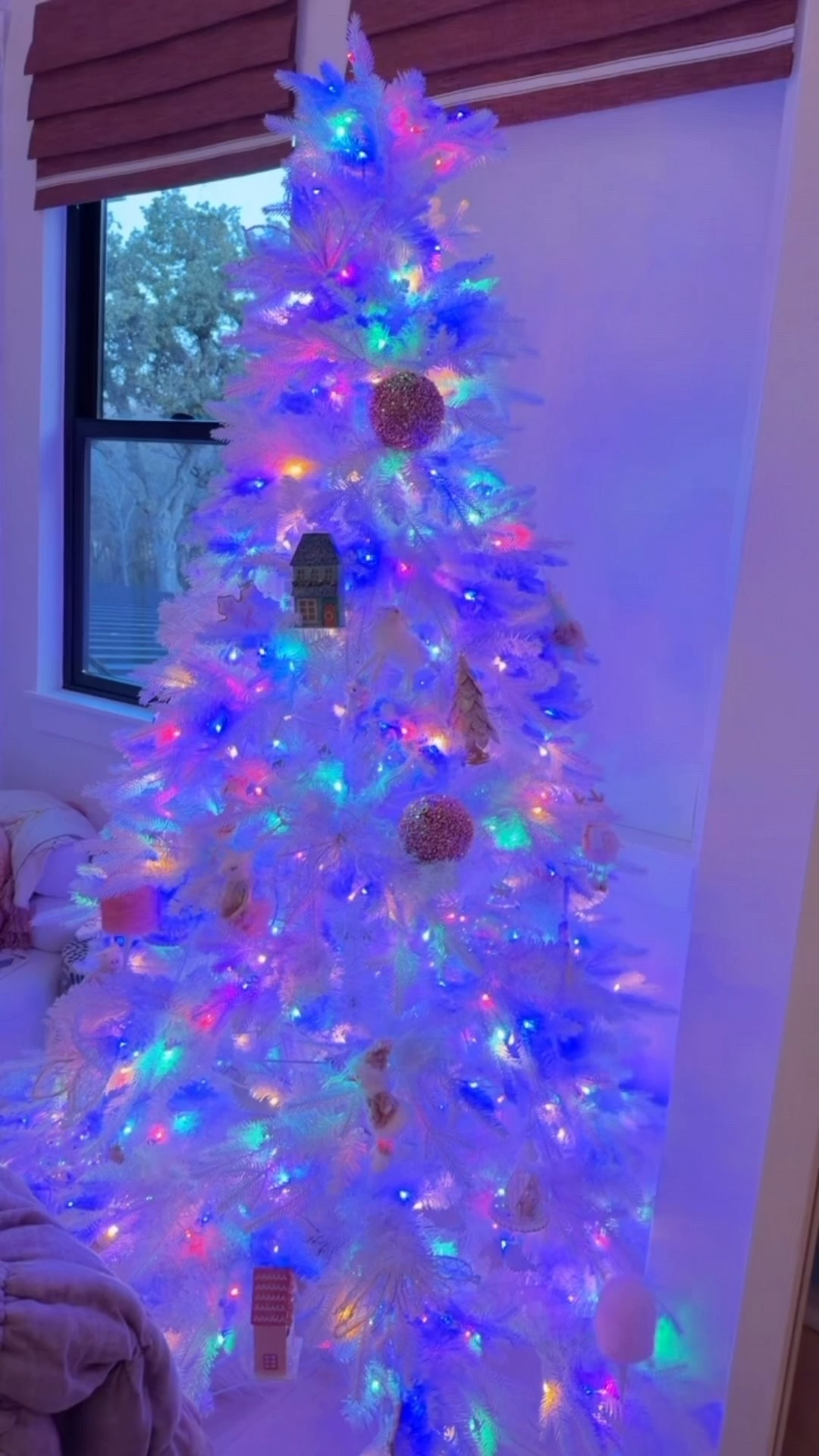 white christmas tree with multi color and warm white lights 

#LTKmomlife #LTKFamily #LTKHoliday