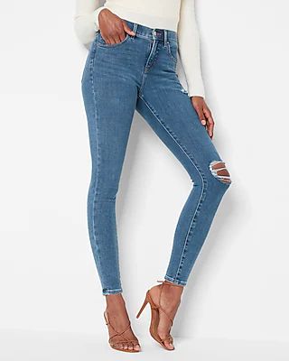 Mid Rise 4-way Hyper Stretch Medium Wash Ripped Skinny Jeans | Express