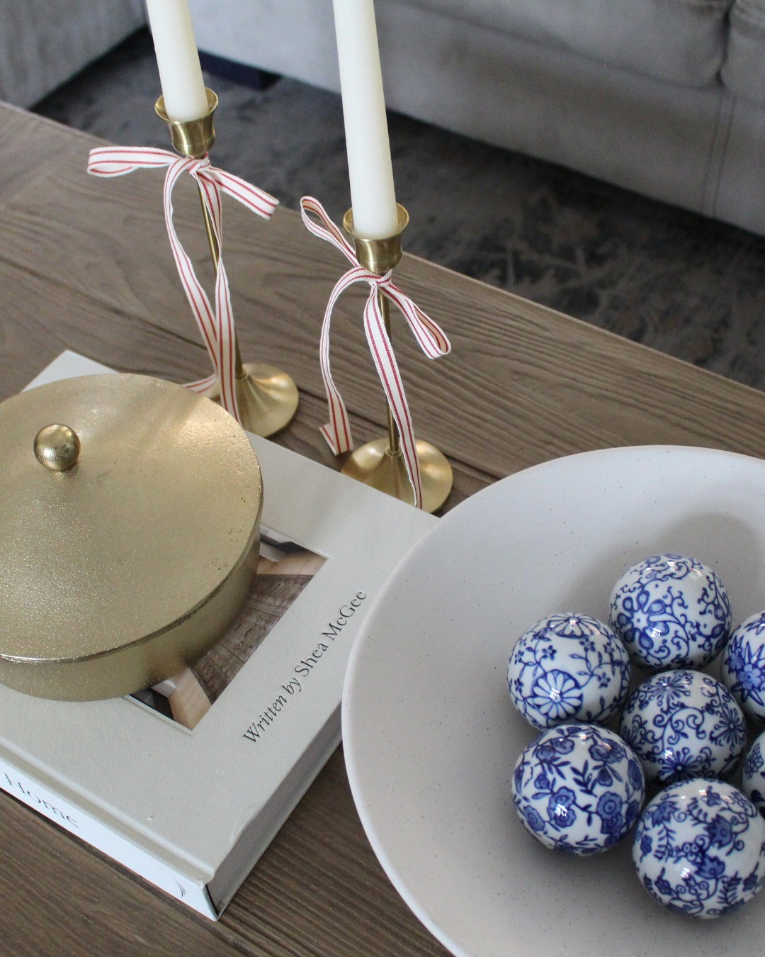 Simple red white and blue decor. Ceramic floral white and blue decorative balls. White and red striped ribbon. Elegant 4th of July home decor. Patriotic decor. 

#LTKHome #LTKSeasonal