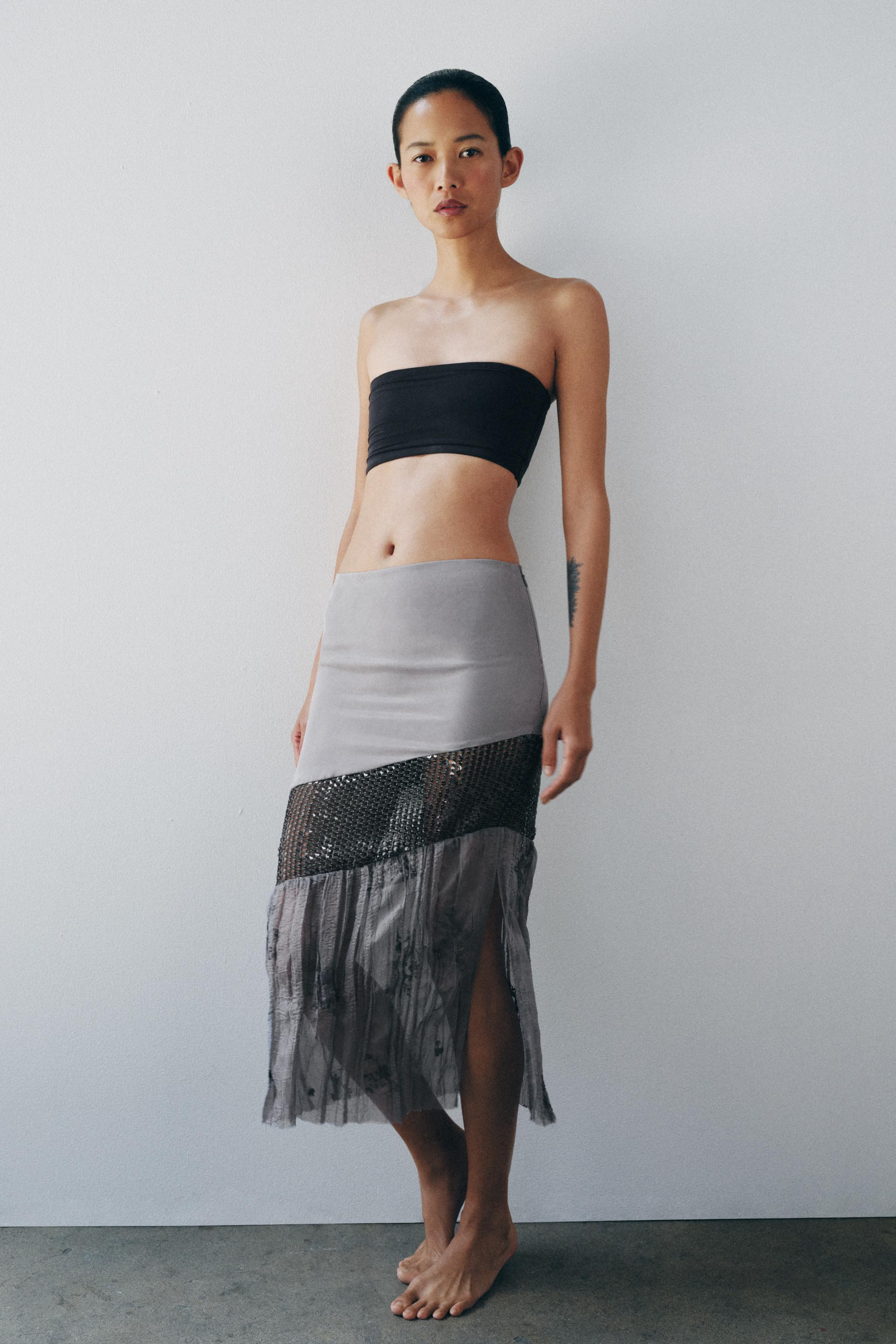 Mid-rise midi skirt made from a lyocell and viscose blend. Featuring tonal sequin appliqu\u00e9. ... | Zara US