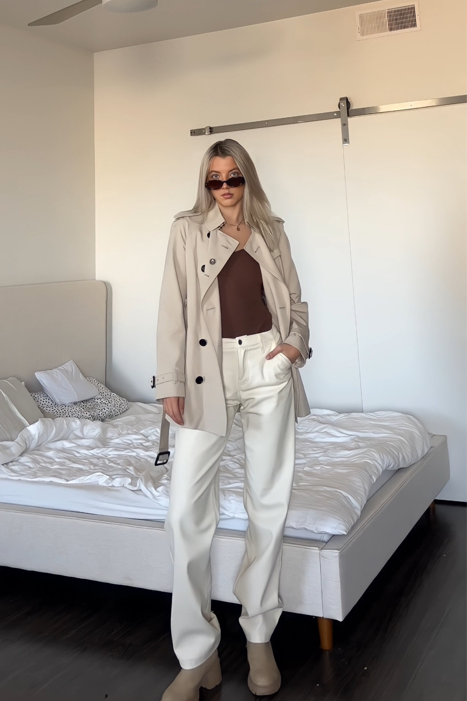 fall outfit🍂 wearing a Burberry trench coat, Hollister white leather pants, a smooth like butter seamless brown bodysuit, and sand colored ankle booties

#LTKstyletip #LTKSeasonal