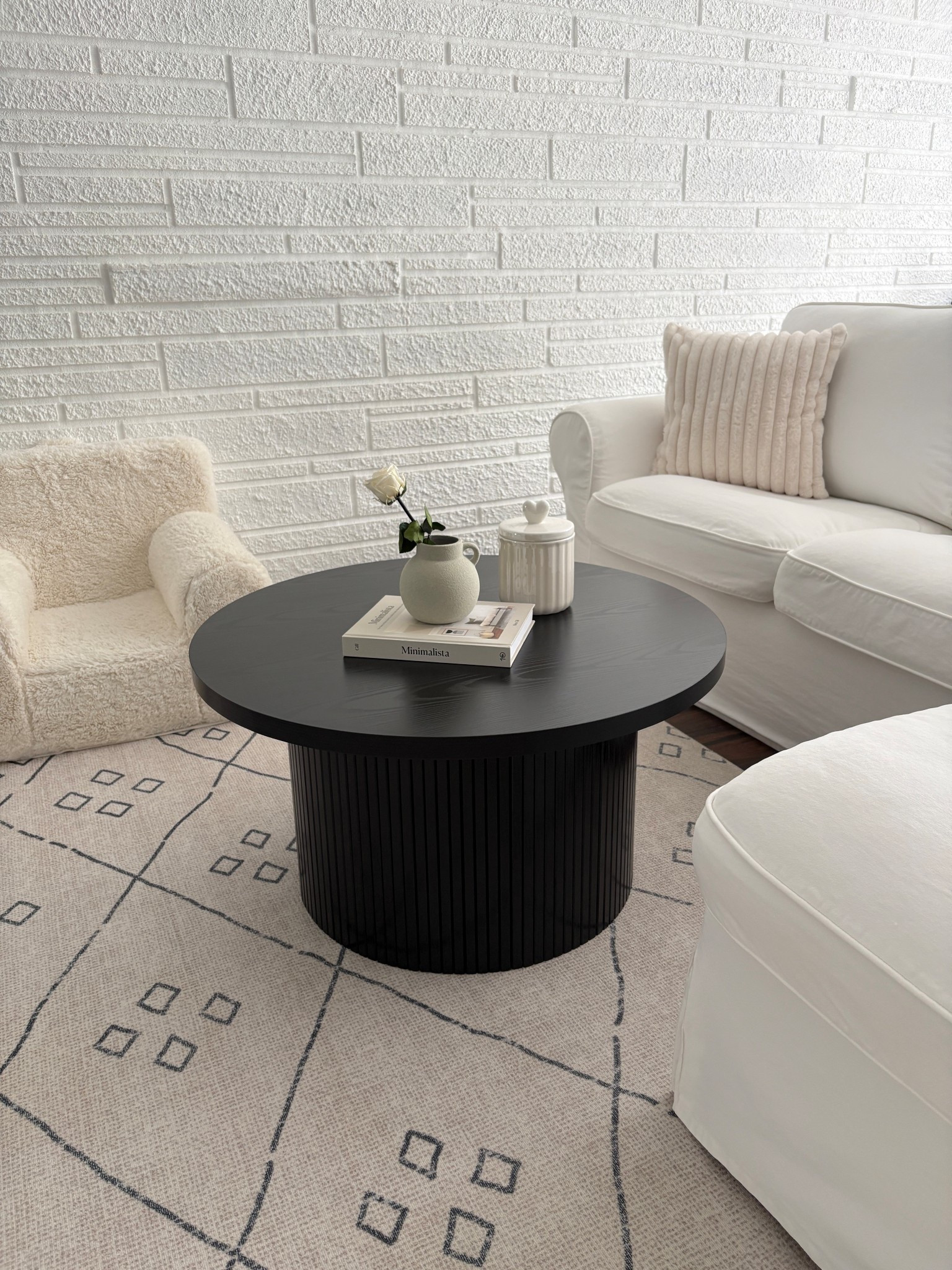 family room. living room. neutral style. minimalist home. home decor. modern coffee table. kids sherpa chair. white couch. faux fur throw pillows. 

#LTKHome