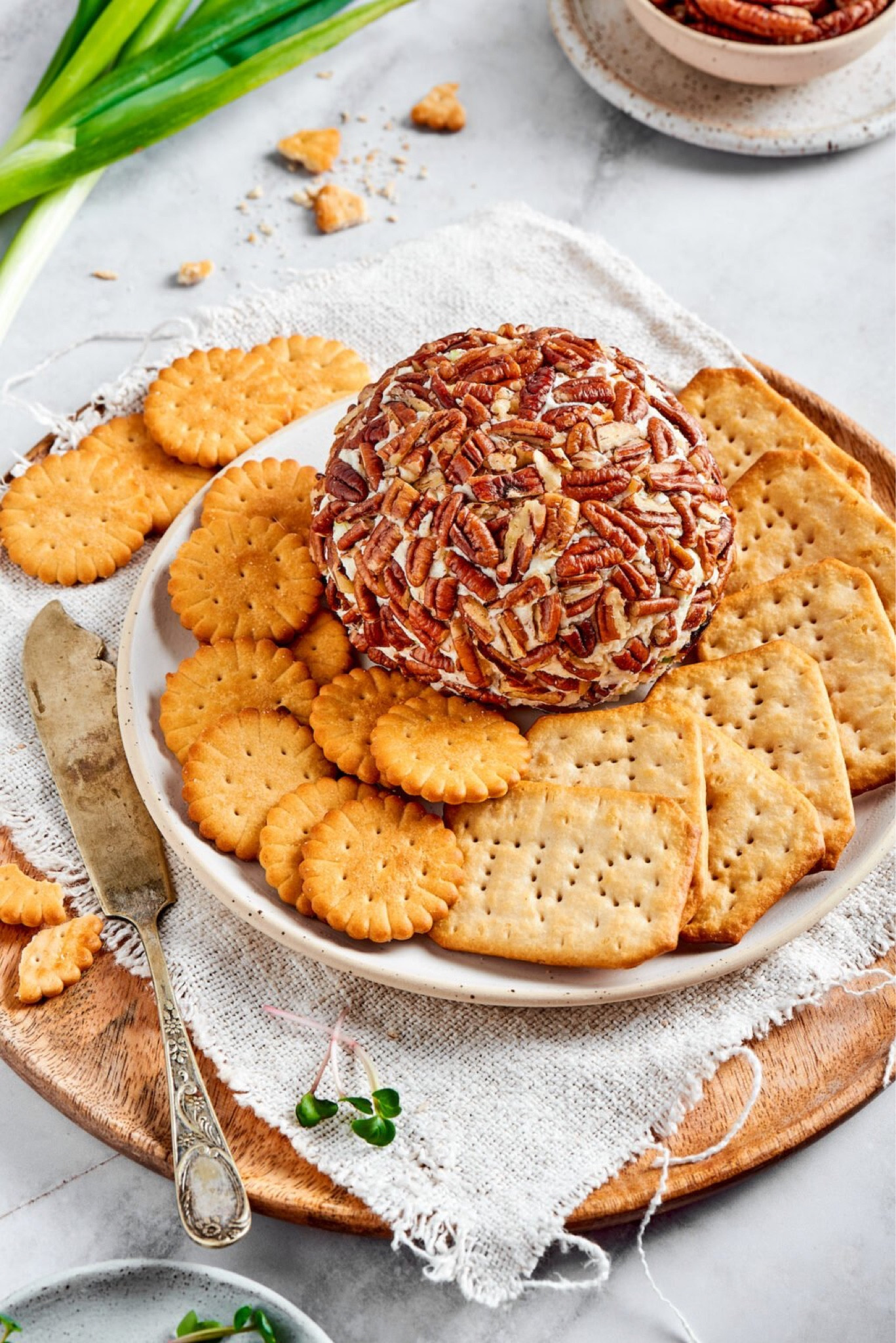 Easy Cheese Ball-this simple and delicious cheese ball recipe is a favorite appetizer during the holiday season. It is easy to make, can be made in advance, and is great served with crackers or cut up vegetables.

#LTKSeasonal #LTKFindsUnder100 #LTKHome
