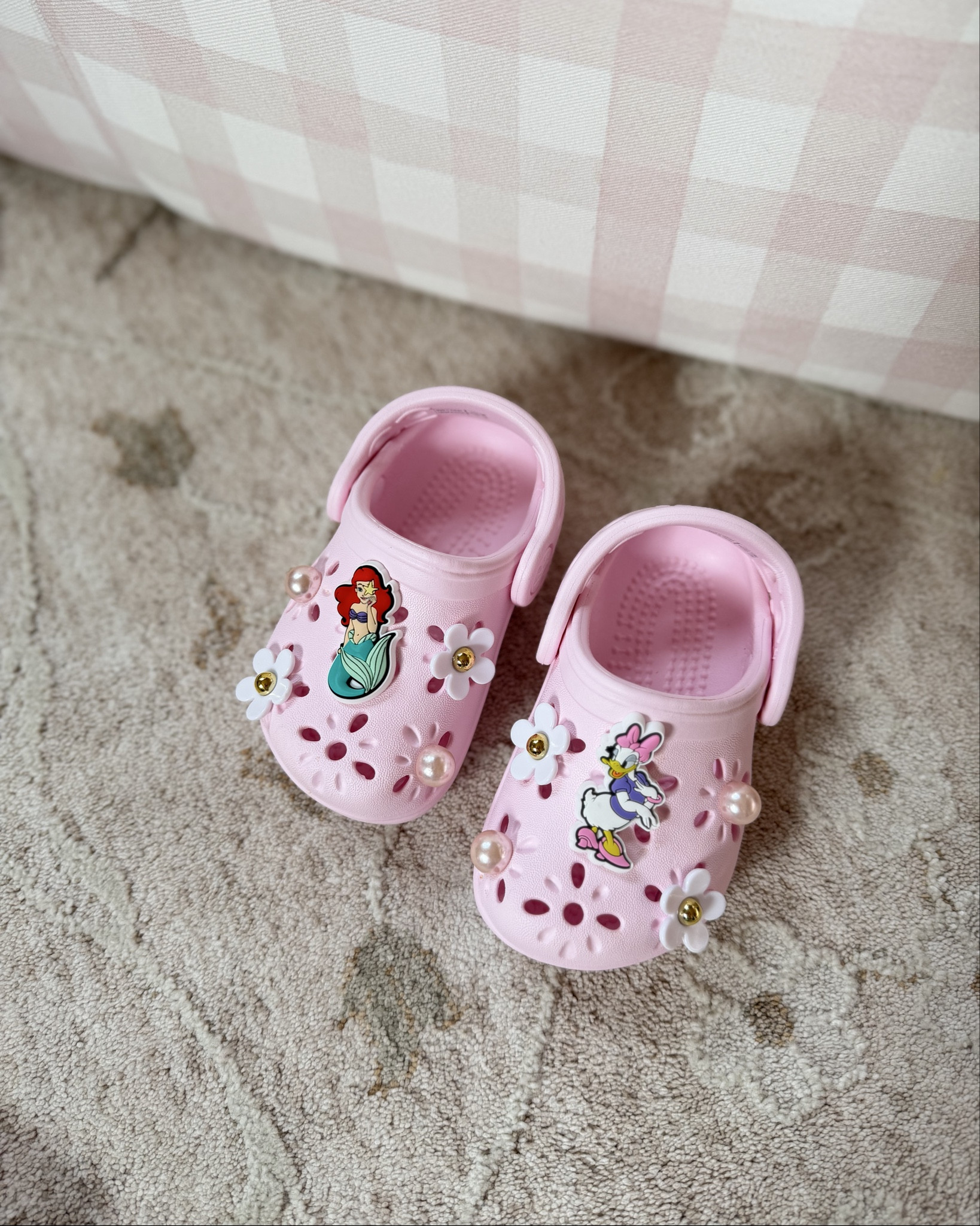 Evie’s spring / summer crocs 🩷🩷 cutest floral jibbitz with pearls and some other fave Disney characters! She wears a 5 in crocs!

Toddler girl, toddler girl spring shoes, pink crocs, floral cut out crocs 

#LTKSeasonal #LTKmomlife #LTKKids