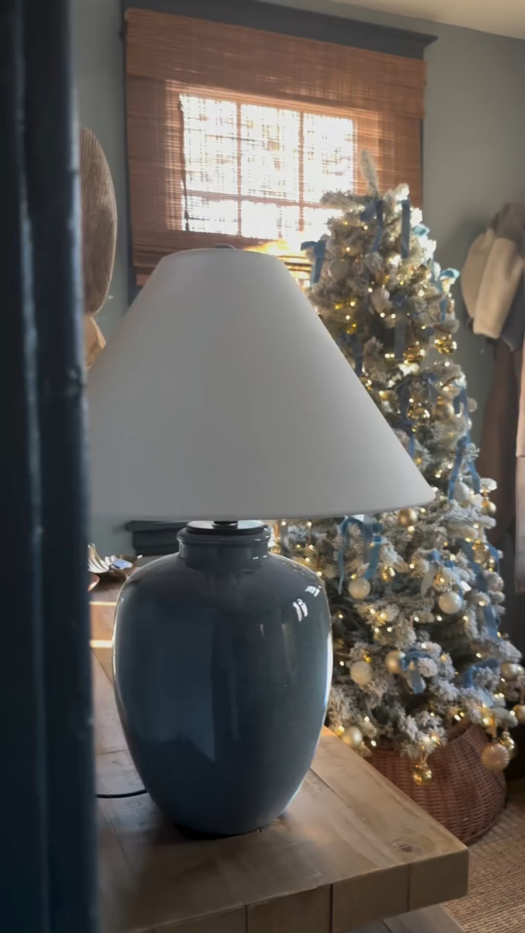 The blue room lives on 🩵 In years past, the sitting room held this true adorned with blue ribbon. With our recent renovation, the mudroom became the perfect spot! It glows from the road, to our guests. Get the entire room look: Comment SHOP below to receive a DM

https://liketk.it/5DRrm 

#coastalchristmas #classichomedecor #nancymeyerschristmas #bluechristmas #coastalchristmastree