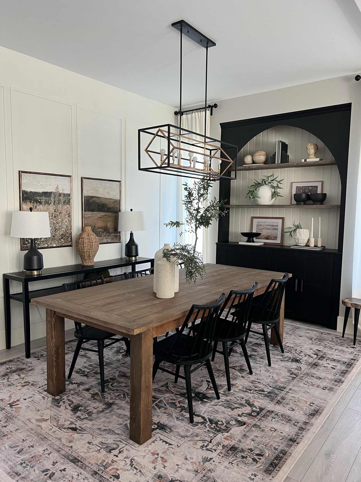 Current dining room view! 
Our built in cabinet was a diy! Colors are SW tricorn and SW alabaster. 
My dining table was a custom order from a local company.. not able to link. 