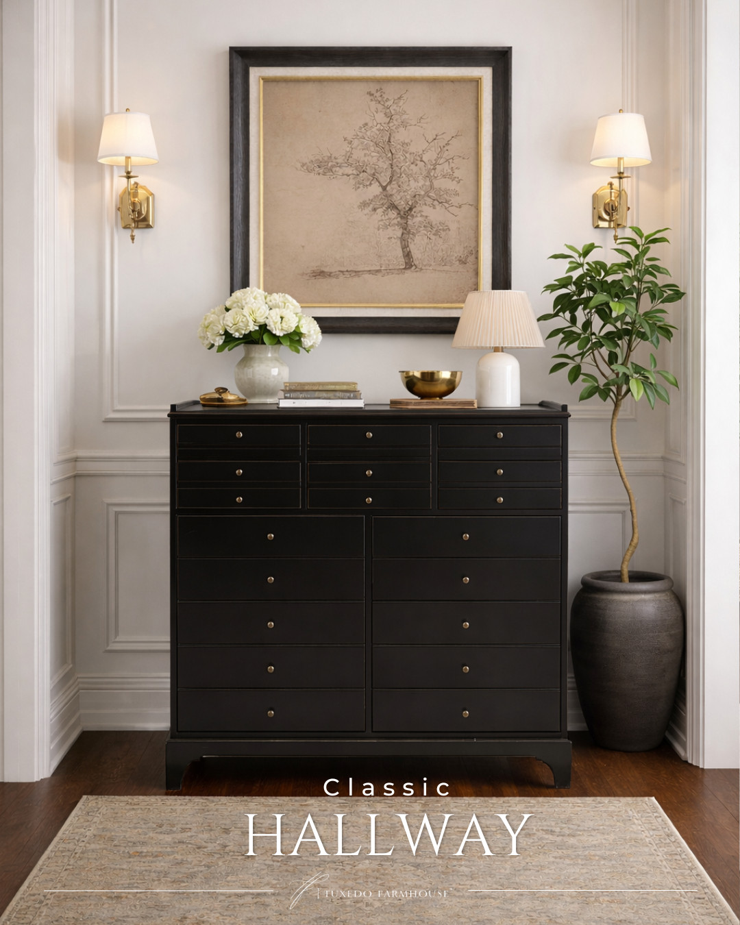 A refined hallway styled with a neutral-toned area rug. The muted, vintage-inspired area rug anchors the look, paired with a framed sepia tree illustration, a black multi-drawer cabinet with brass hardware, a sculptural ceramic table lamp with a pleated shade, and a potted schefflera tree in a dark vessel. Together, these pieces balance organic texture, classic detailing, and refined contrast. 

 

#LTKSeasonal #LTKHome