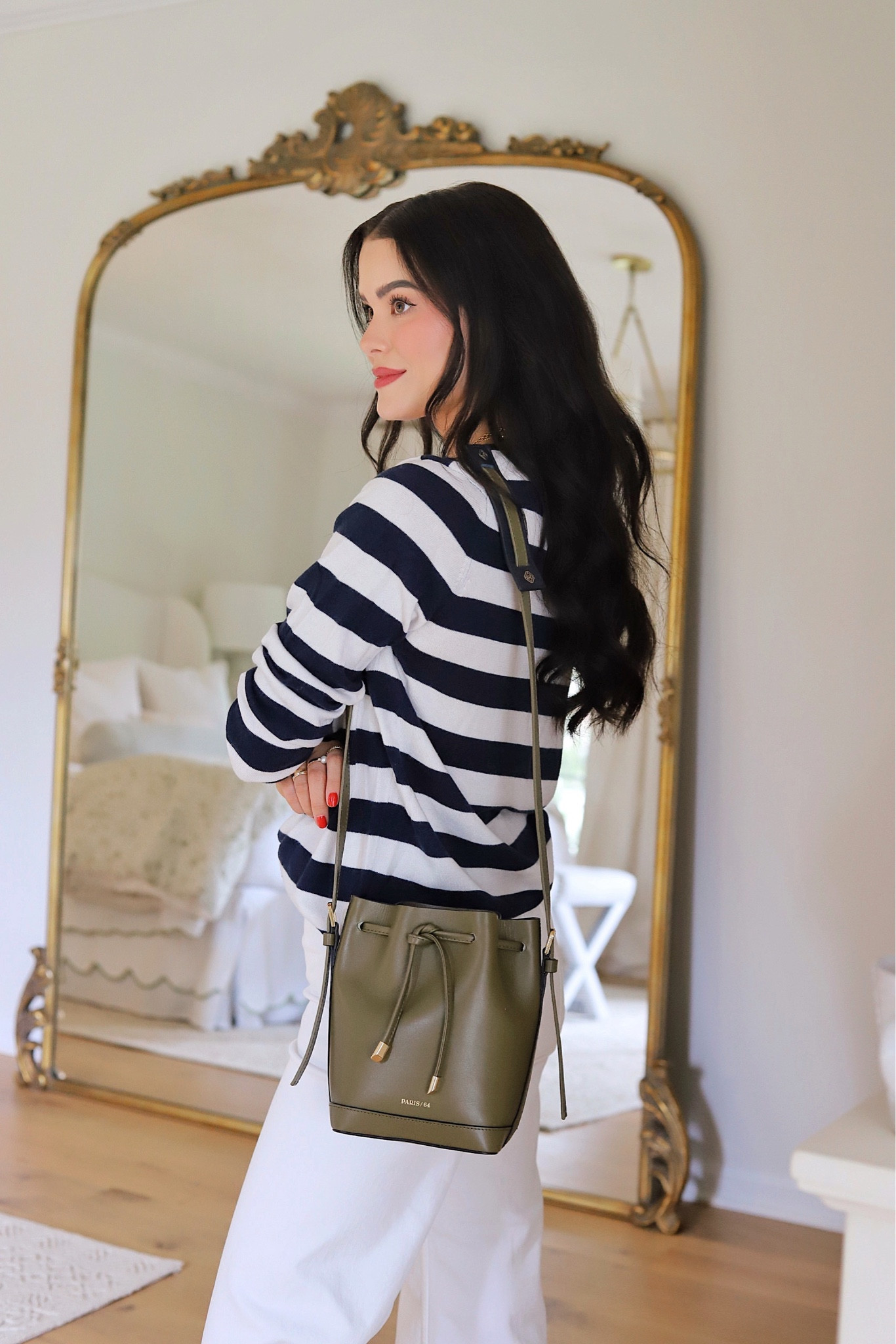 Navy and white striped Amazon sweater / white denim jeans / Chanel necklace / green crossbody