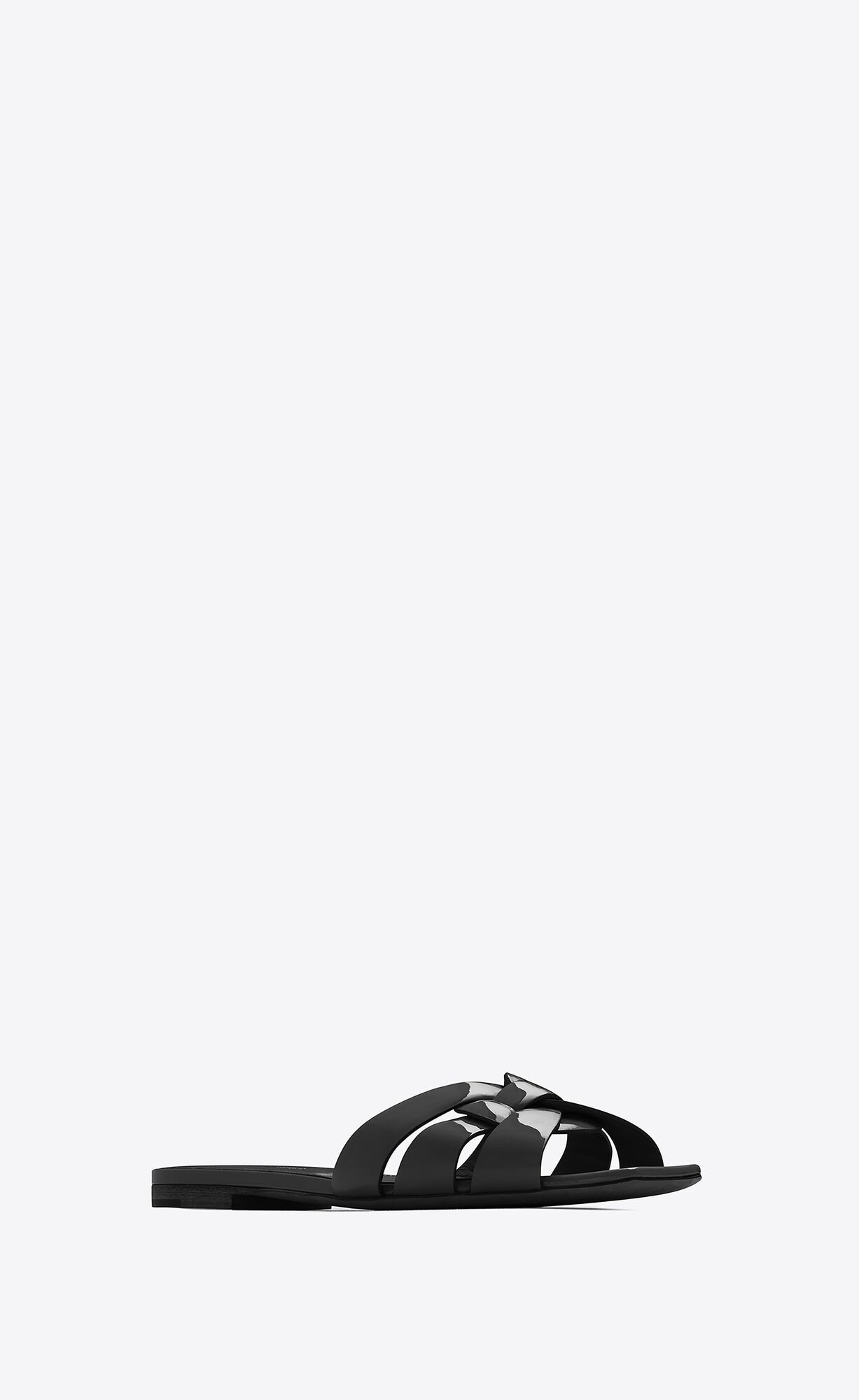 slide sandals in patent leather with intertwining straps. we recommend selecting half size bigger... | Saint Laurent Inc. (Global)