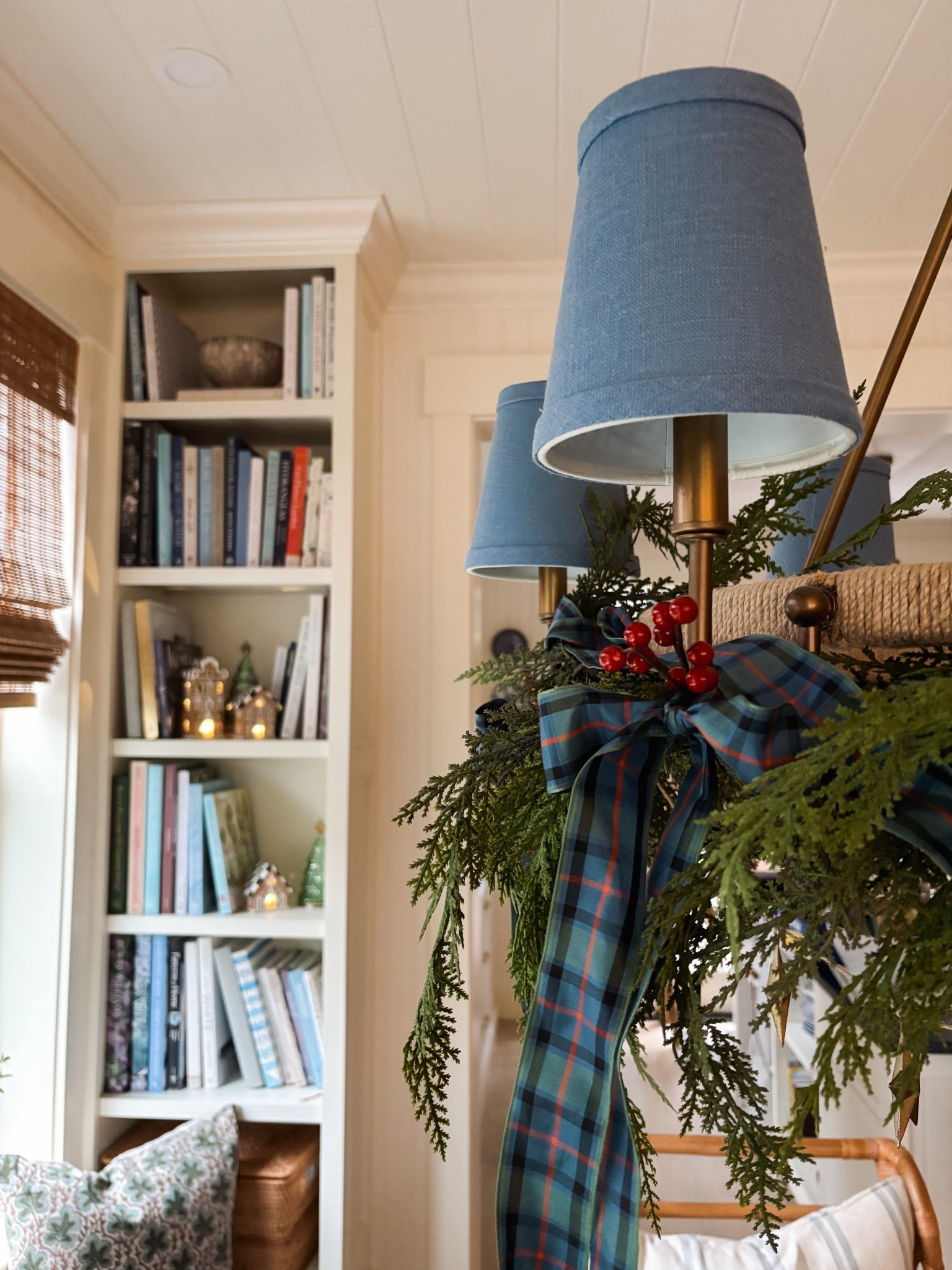 Christmas chandelier with red berries plaid ribbon and faux cedar garland - also gingerbread houses 

#LTKSaleAlert #LTKHome #LTKHoliday