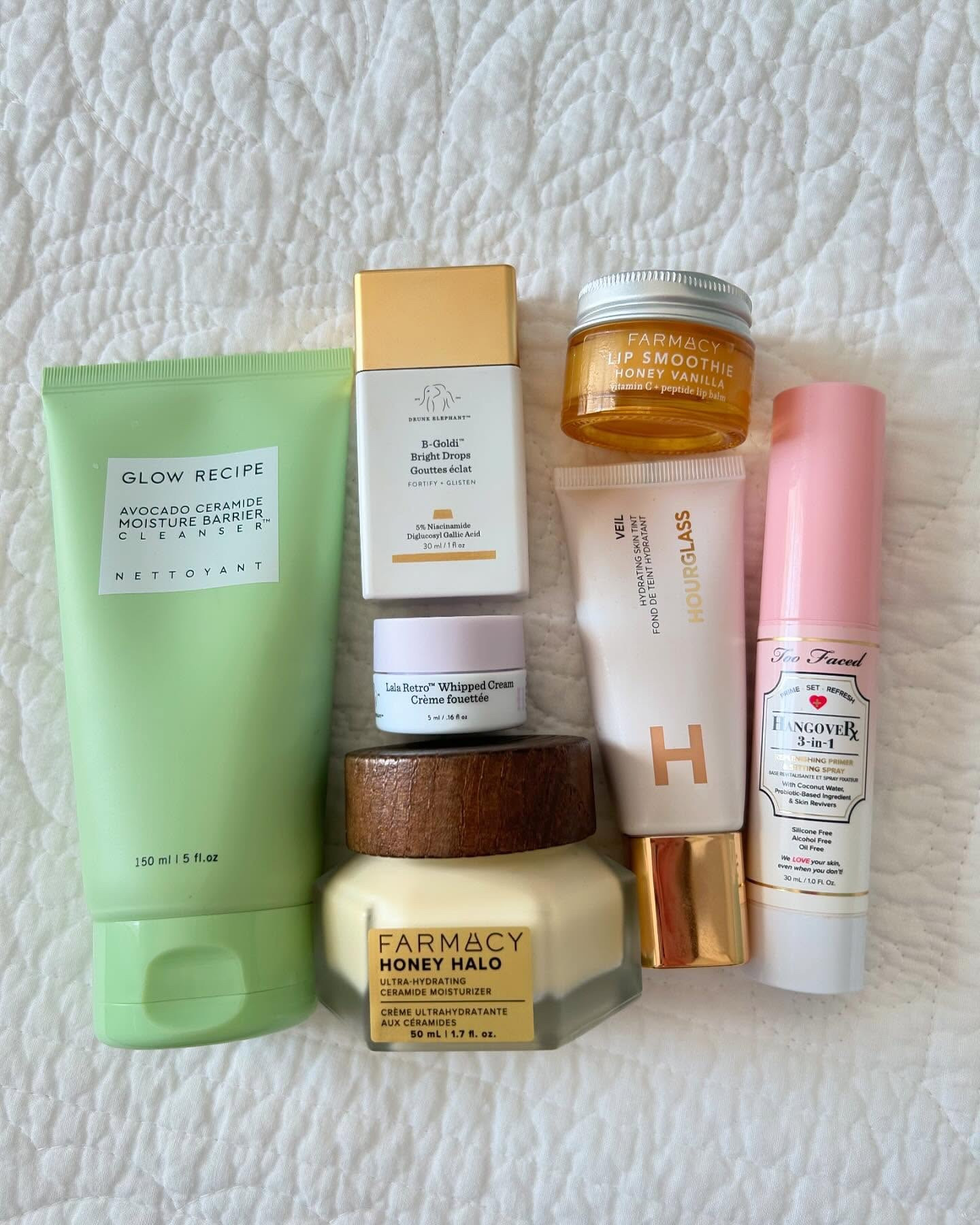 Skincare and makeup flatlay 🎀💚 here are some mini reviews of the products! ☺️

@drunkelephant b-goldi and lala retro 🩷 I love to add a drop or two of b-goldi to my moisturizer if I want glowy skin, or my foundation if I want a dewy look! B-goldi also has 5% niacinamide, which helps with oily or inflamed skin. I have been loving the rich texture of lala retro, and have been using it as eye cream lately since I recently ran out of my eye cream ☺️

@glowrecipe avocado ceramide cleanser 🥑 this cleanser is so gentle and never leaves my skin feeling stripped and dry! 

@farmacybeauty honey halo ceramide cream and lip smoothie 🍯 I have been loving these two! The lip smoothie balm tastes just like syrup and waffles and makes my lips feel super smooth and look glossy, and the honey halo cream smells and feels so amazing - I so wish there was a body cream of this! I love to use this moisturizer on my neck since neck skin is delicate and similar to the skin of your eyelids.

@hourglasscosmetics hydrating skin tint ⌛️ I love how lightweight this is and how it gives your skin a subtle, no makeup tinted look! To me this is perfect to mix in with moisturizer. 

@toofaced hangover setting spray 🥥 I am always going to be obsessed with the coconut scent of the tf hangover products! I love this setting spray when I am doing my makeup and want a glowy, dewy look!

I hope you're all having a great day today ☺️🫶🏻🎀

*Contains Pr*

#toofaced #sephorafinds #luxurymakeup #skincareflatlay #skincareflatlays #makeupflatlay #makeupflatlays #hourglasscosmetics #drunkelephantskincare #drunkelephant #farmacybeauty #farmacyskincare #farmacyfridays #farmacyforlife #glowrecipe #glowrecipeskincare #sephoraskincare #sephoraaddict #highendskincare