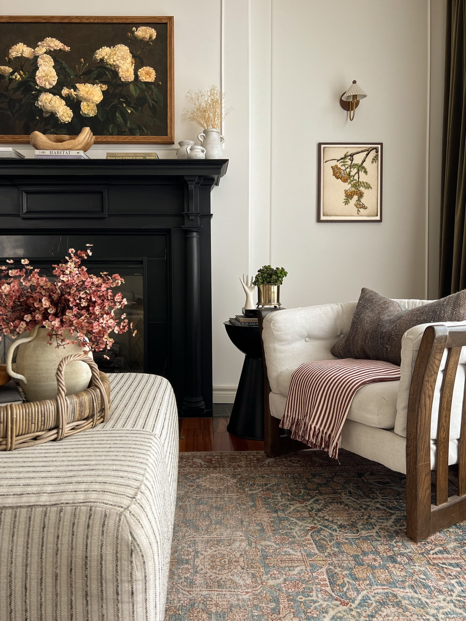 Living room decor, faux florals, ottoman, vase, brass sconce 

#LTKhome