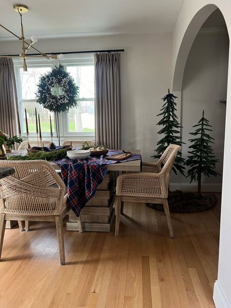 Holiday dining room table tablescape

Plaid tablecloth
Woven chairs
Farmhouse table
Neutral dining room
Archway
Prelit Christmas tree 

#LTKHoliday #LTKSeasonal #LTKhome
