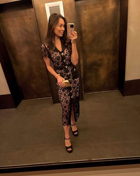 Kat Jamieson of With Love From Kat wears a lace midi dress. Holiday style, lace dress, chic style, cocktail dress, black pumps, gold clutch, platform sandals.

#LTKSeasonal #LTKstyletip