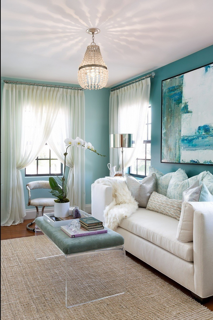 Fresh & Refined: Living Space Love 💙💚Soothing blue-green accents meet crisp white seating in this effortlessly elegant living space. The clean lines of the glass coffee table (LTK affiliate) bring in just the right touch of modern to balance the soft, coastal tones.It’s a perfect mix of comfort, style, and lightness—designed to feel both curated and lived-in.

#LTKFamily #LTKStyleTip #LTKHome