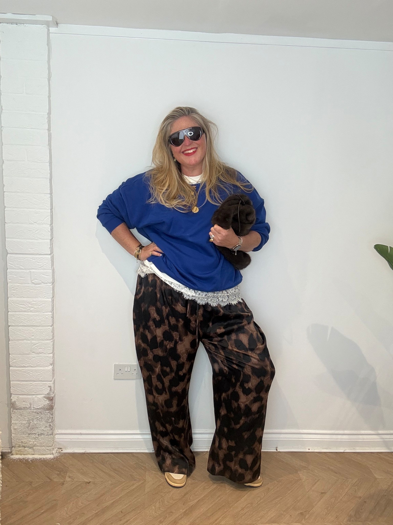 Cobalt blue sweatshirt, leopard print trousers, lace tshirt, faux fur bag, sunglasses, red lipstick, trainers 

#LTKplussize #LTKstyletip #LTKspring