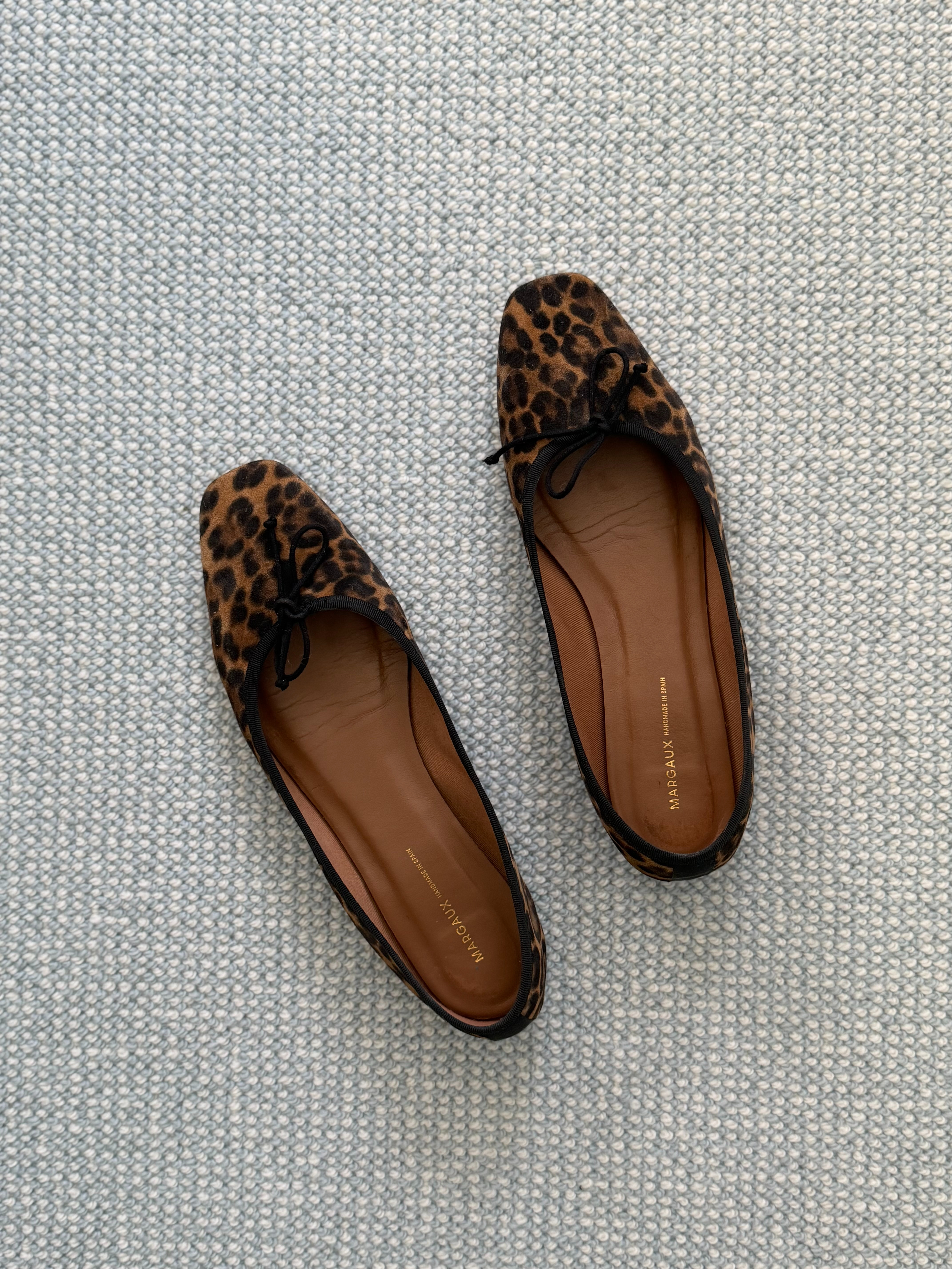 A chic (and comfortable) leopard ballet flat -- the Fonteyn flat from Margaux. 

Sizing - I find true to size. I am a US 12 and wear the 43M in these (based on their shoe size chart.)  

 