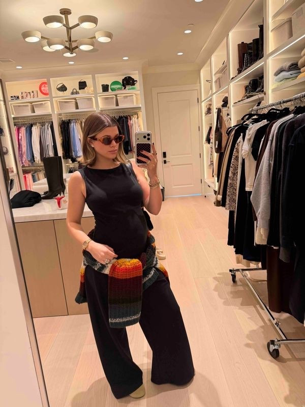 Sofia Richie Grainge's Thanksgiving holiday outfit. Sweater A ladder-stitched, stand-collar pullover of luscious cashmere. Created entirely from recycled yarns, with engineered stripes in nine colors that span solid and marled hues. Relaxed by dropped shoulder seams.