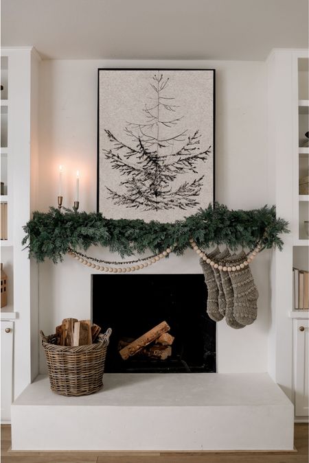 Shop our Christmas mantel decor including these cute knit stockings, faux cypress garland, wood and bell garland, and pine tree art! This is the 40x30” black float frame canvas - up to 60% off at collectionprints.com right now! 

#LTKHolidaySale #LTKsalealert #LTKhome