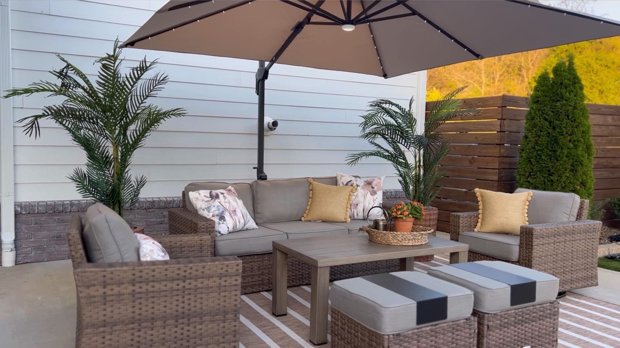 I love this outdoor wicker patio set so much! It is a great Amazon find and super affordable! The chairs glide and swivel, and the ottomans also serve as storage! I love the warmth it adds to this space. Looks great paired with our solar cantilever umbrella and new striped outdoor rug, both also super affordable!

#LTKStyleTip #LTKWatchNow #LTKHome