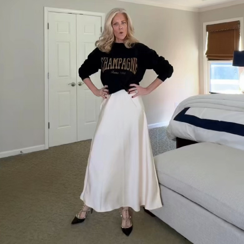 Casual warm date night. Elastic waist (love that)  silk ivory skirt. Black/brown warm sweatshirt tucked. Elevate the look a bit with heels and purse with chain strap. Size small in top and skirt. Size 8 shoes. 

#LTKSeasonal #LTKOver40