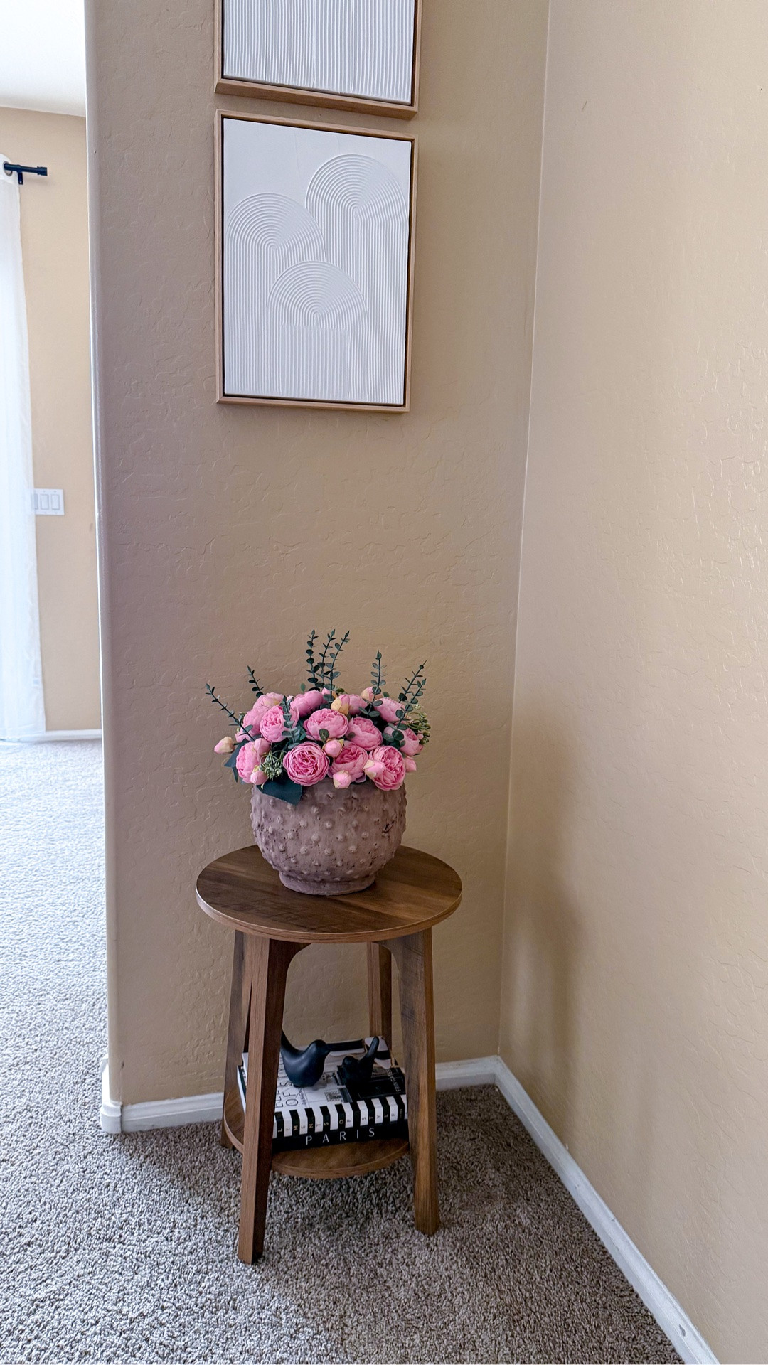 This cute two-tier side table from Amazon and wall art from Target create a charming corner styling in a small space. The table is sturdy enough to hold several books or decorative items.

#LTKSeasonal #LTKHome #LTKSaleAlert