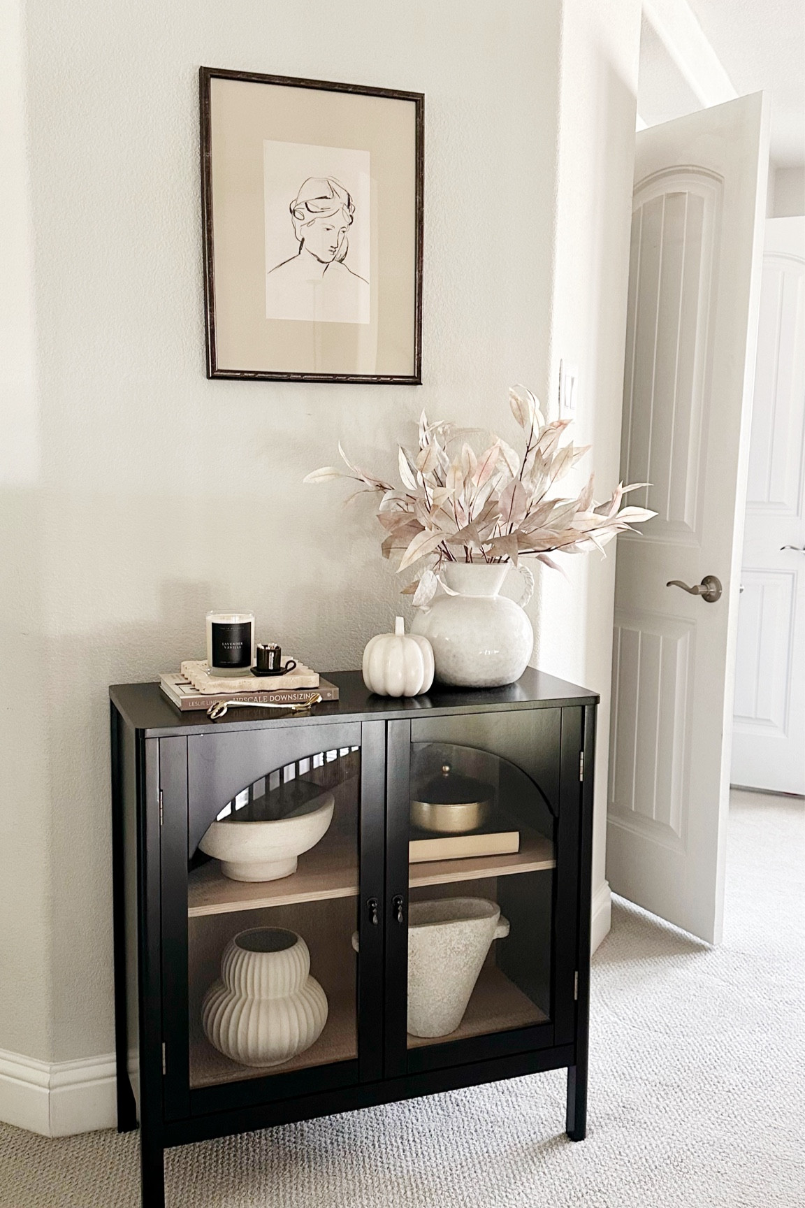 This glass cabinet is perfect for a narrow hall or small entryway. Perfect way to create a little stylish moment in your home. 

#LTKFallSale #LTKSeasonal #LTKHome