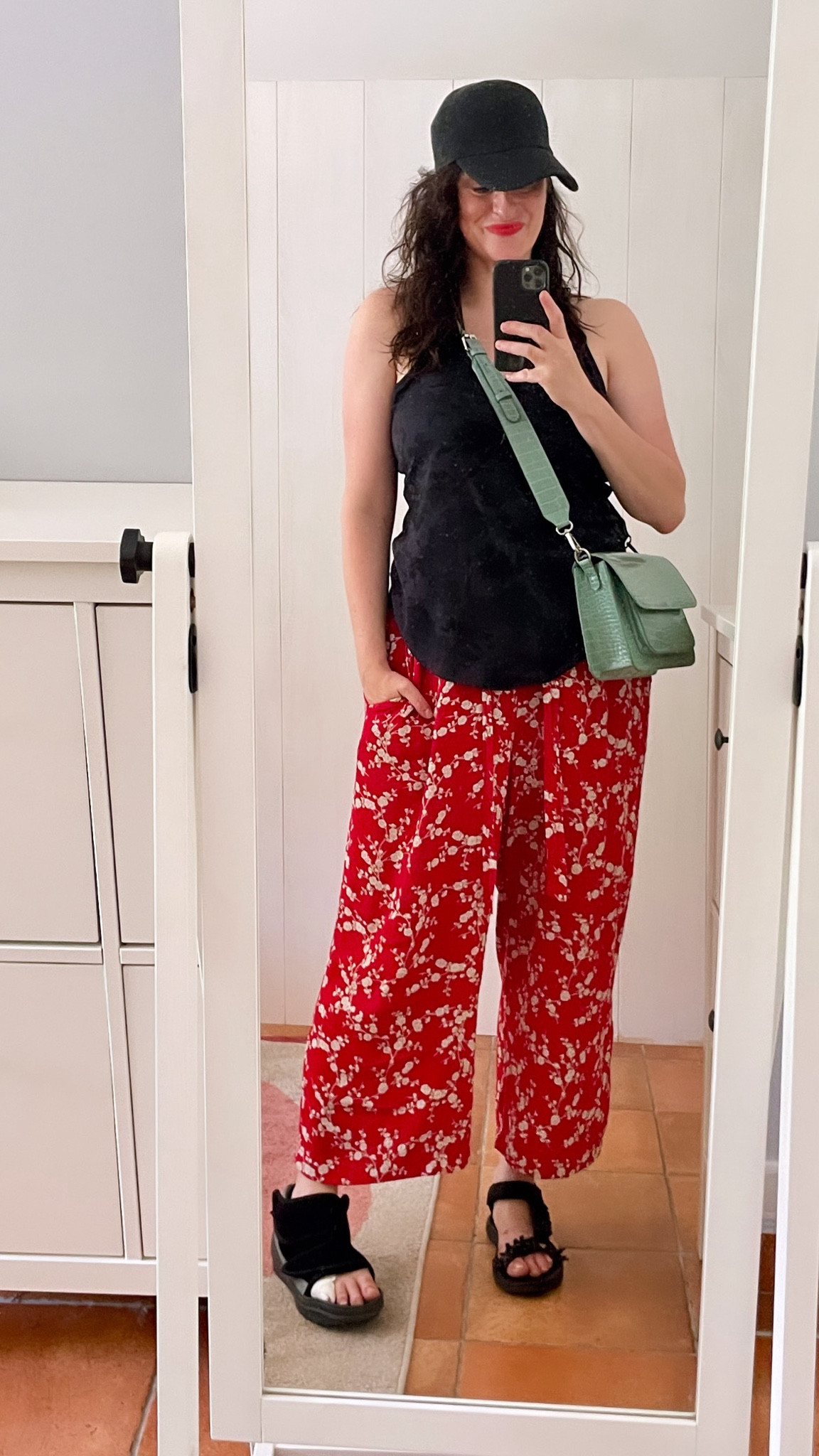 . Black baseball cap #ca (similar, linked)
. Black racerback tank #crzyoga (linked)
. Flower print red wide leg pants #hm x #gpjbaker 
. Mint green crossbody bag #hvisk 
. Beaded trek sandals #zara (similar, linked)
. Matte red lipstick #revlon (linked)

#LTKfrance #LTKmidsize #LTKsummer