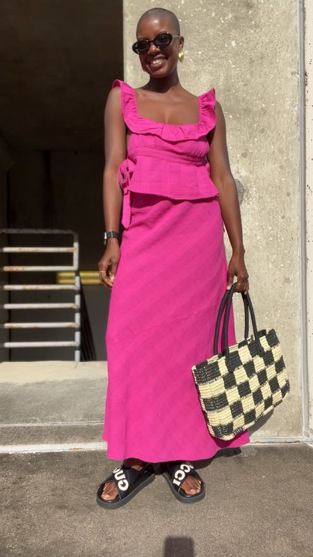 Great travel vacation look! Pink skirt set with flutter ruffle sleeve and side ties, black round sunglasses, gingham straw tote bag, black gucci sandals and gold seashell earrings. Im Wearing a small  

#LTKunder100 #LTKshoecrush #LTKtravel