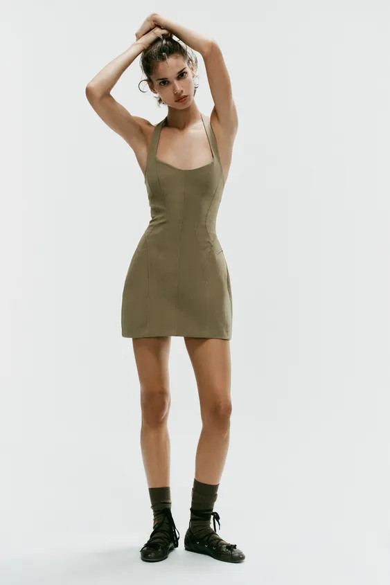 Short stretchy dress with an adjustable halter neck featuring hidden buttons and a round neckline... | Zara US