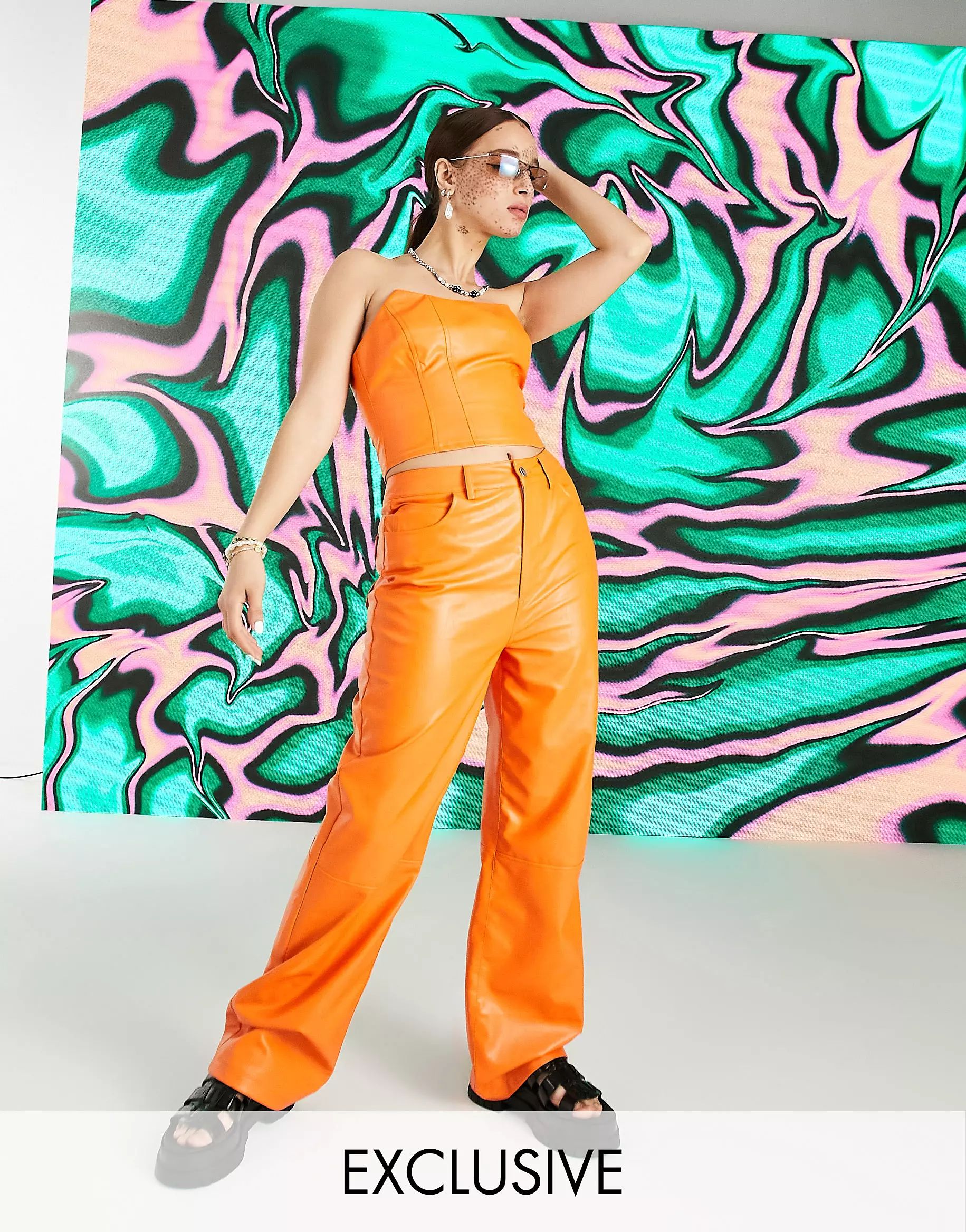COLLUSION 90s fit faux leather dad pants with carpenter detail and V shape waistband in orange - ... | ASOS (Global)