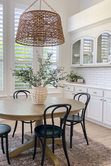 Breakfast nook styling with woven chandelier olive branches and bistro chairs. Fall styling + olive branches + Anthropologie vase 
Bonus: Our woven chandelier is currently on sale! As well as our anthro vase! 

#LTKSeasonal #LTKsalealert #LTKhome