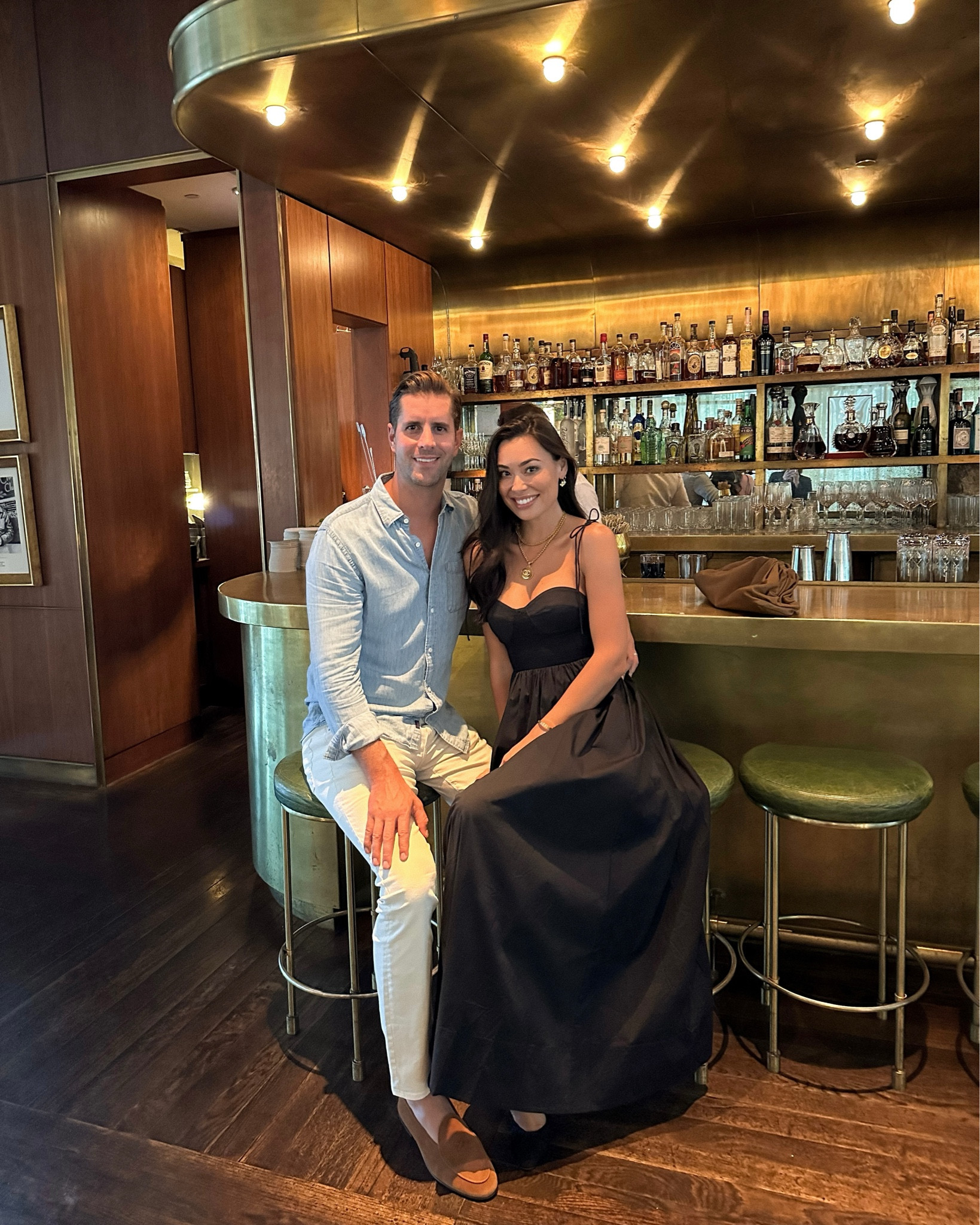 Kat Jamieson wears a black dress with a vintage Chanel necklace to dinner in Charleston. Thomas wears a chambray button down with cream jeans and Del Toro loafers. Menswear, date night, his and hers, couple. 

#LTKmens #LTKSeasonal #LTKstyletip