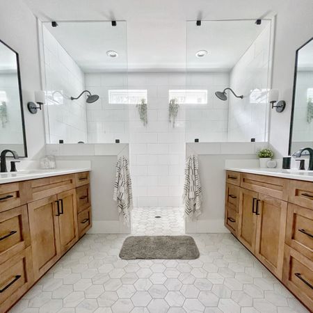 Primary bathroom, vanity, shower head, faucet, rectangle mirror.

#LTKhome