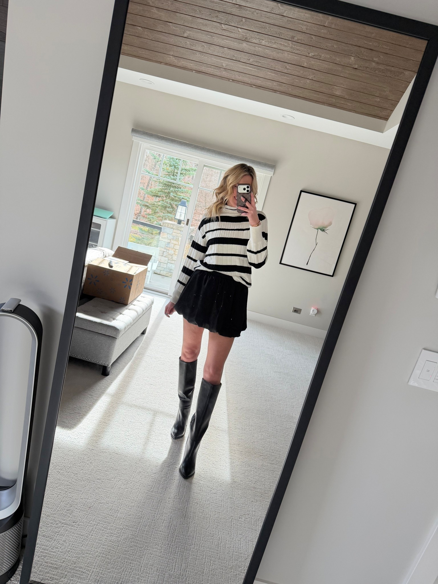 Black and white winter outfit ideas 
Walmart bubble skirt and tall boots
Dolce vita black boots 