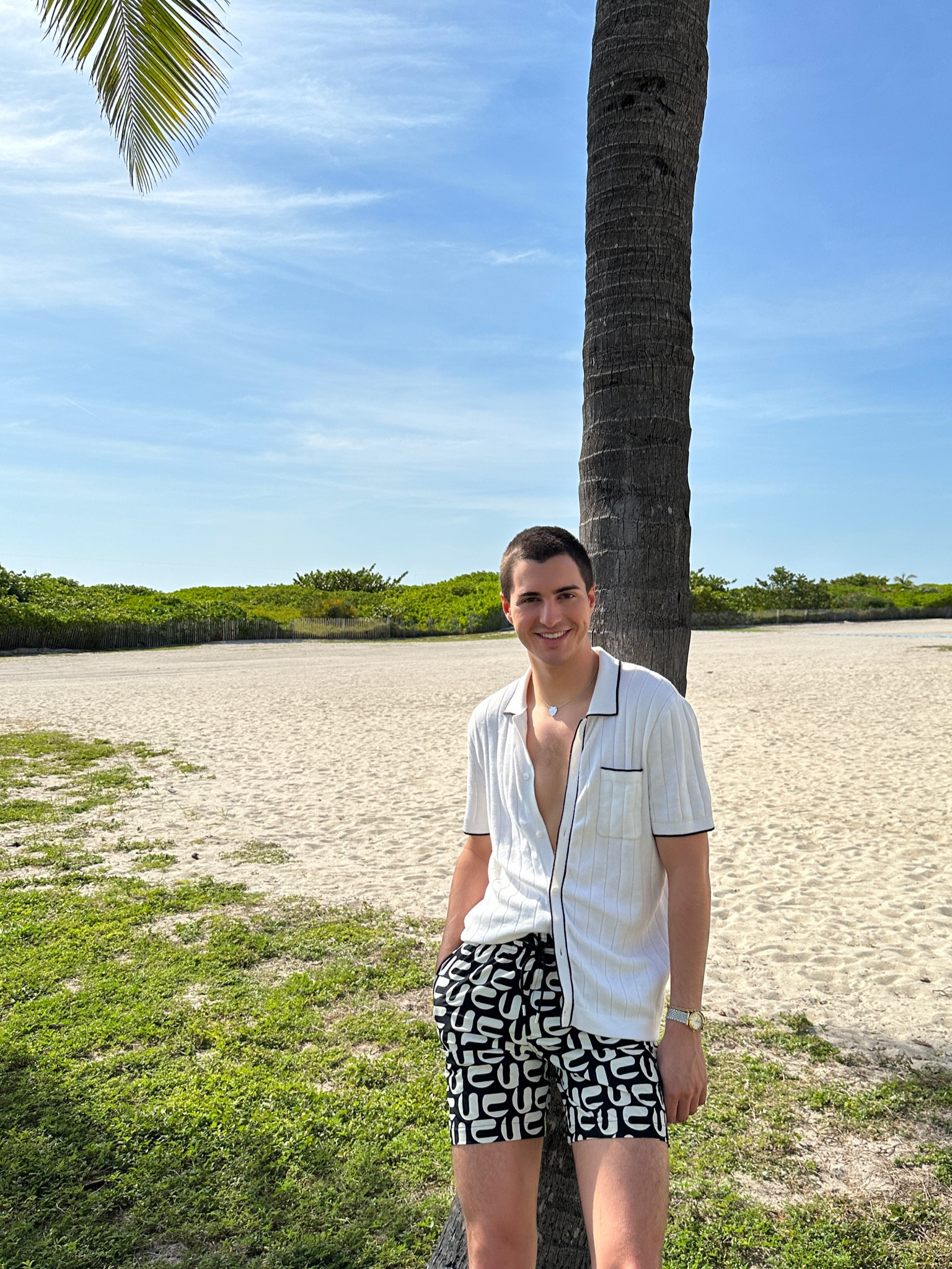 South Beach style with Express wearing a comfy knit polo with a graphic bathing suit that transitions from pool to play with ease. Men’s vacation outfit ideas, classic fashion, swim trunks, men’s style

#LTKmens #LTKSeasonal #LTKswim