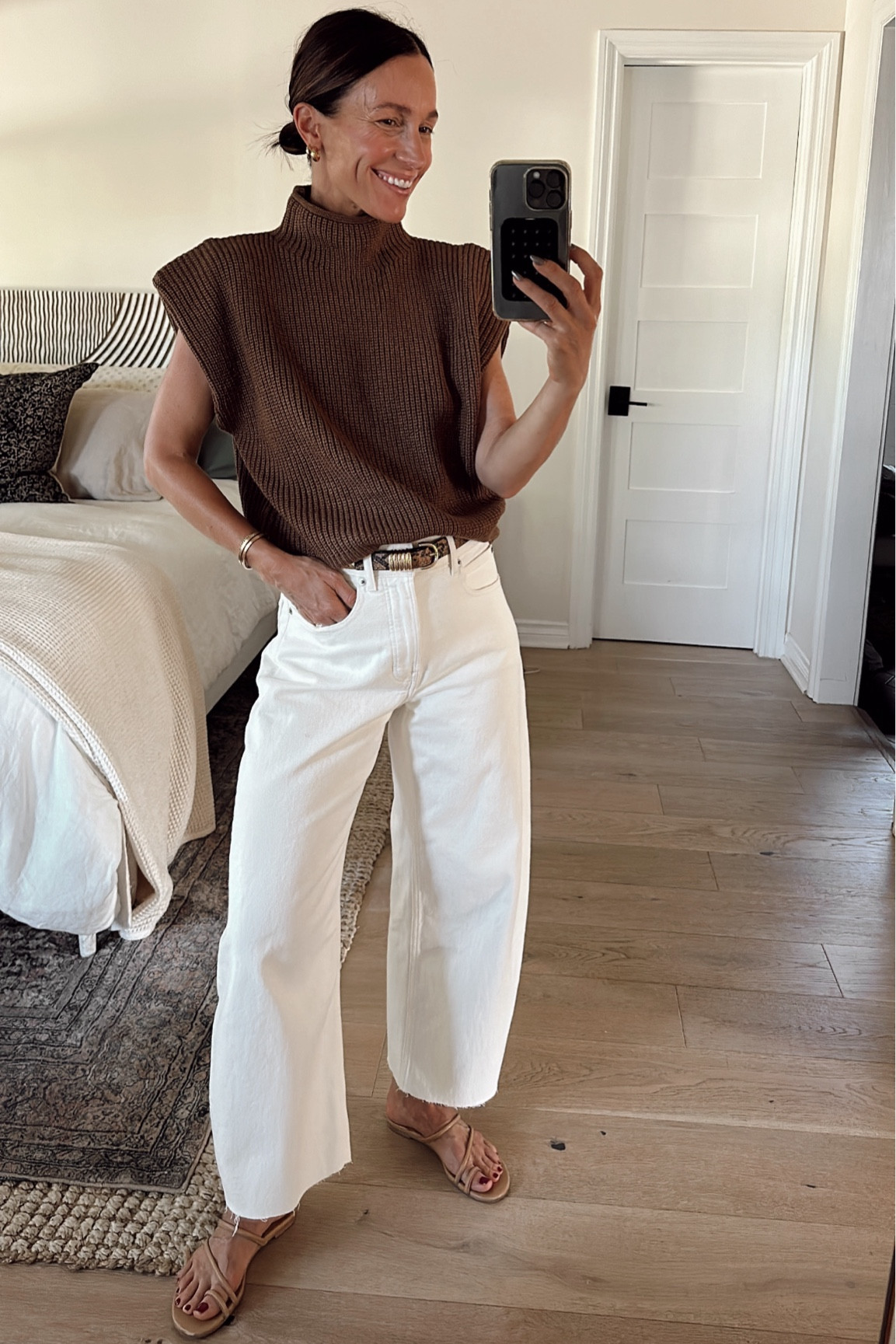  Casual warm fall day outfit for a backyard birthday dinner 
Sleeveless sweater is tts 
Went with a size up in these jeans and cut the hem 

#LTKOver40