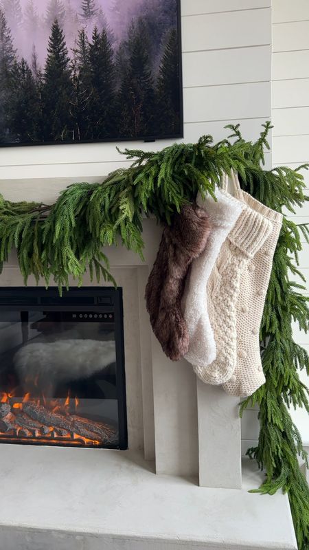 Fireplace, Christmas decor, Christmas stockings, Norfolk garland, bells, ribbons 

#LTKHoliday #LTKSeasonal #LTKVideo