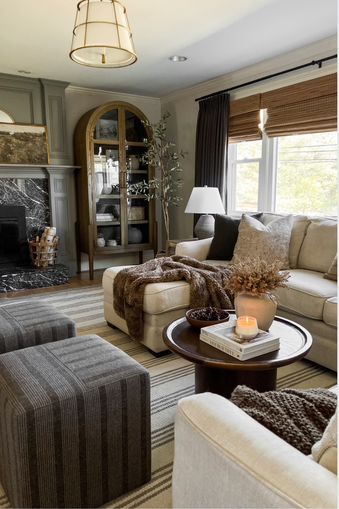 Moody winter living room 
Cream sectional sofa

 @livingwithamanda on Instagram for more decor and style tips 

Arch decor, arch cabinet, moody decor,
tj maxx, loloi, cane furniture, cane chair, pillows, throw pillow, arch mirror
high end look for less, studio mcgee, mcgee and co, target, world market, sofas, couch, living room, bedroom m, bedroom styling, loveseat, bench, magnolia, joanna gaines, pillows, pb, pottery barn, nightstand, cane furniture, throw blanket, console table, target, joanna gaines, hearth & hand, arch, cabinet, lamp,it look cane cabinet, amazon home, world market, arch cabinet, black cabinet, crate & barrel, wayfair finds, Amazon finds

#LTKhome #LTKSeasonal #LTKstyletip