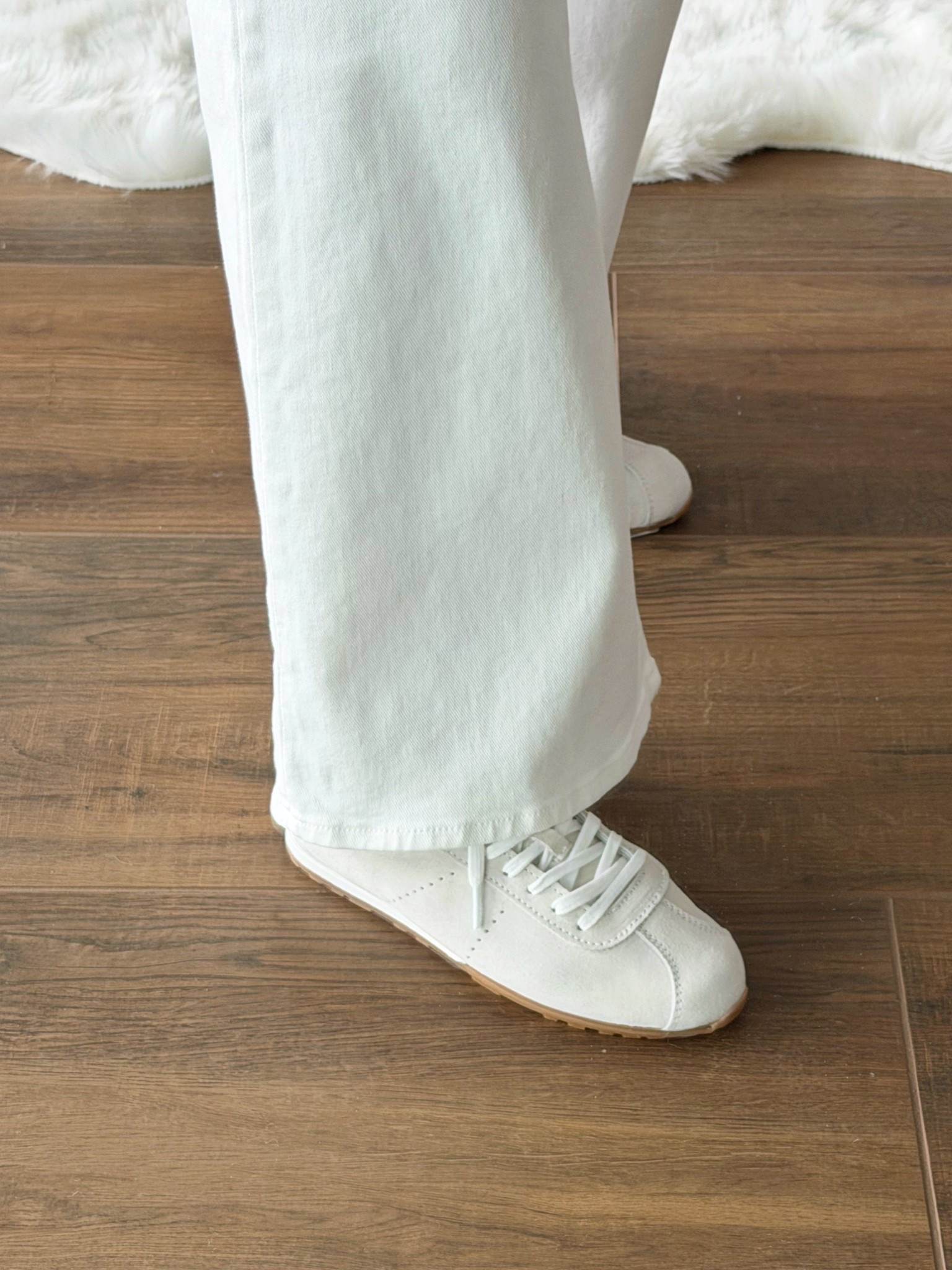 Loving these ivory suede low profile sneakers! Such a cute and trendy silhouette that’s currently on sale. Love them with these wide leg white jeans. Available in lots of fun colors too! 

#LTKActive #LTKootd #LTKSaleAlert