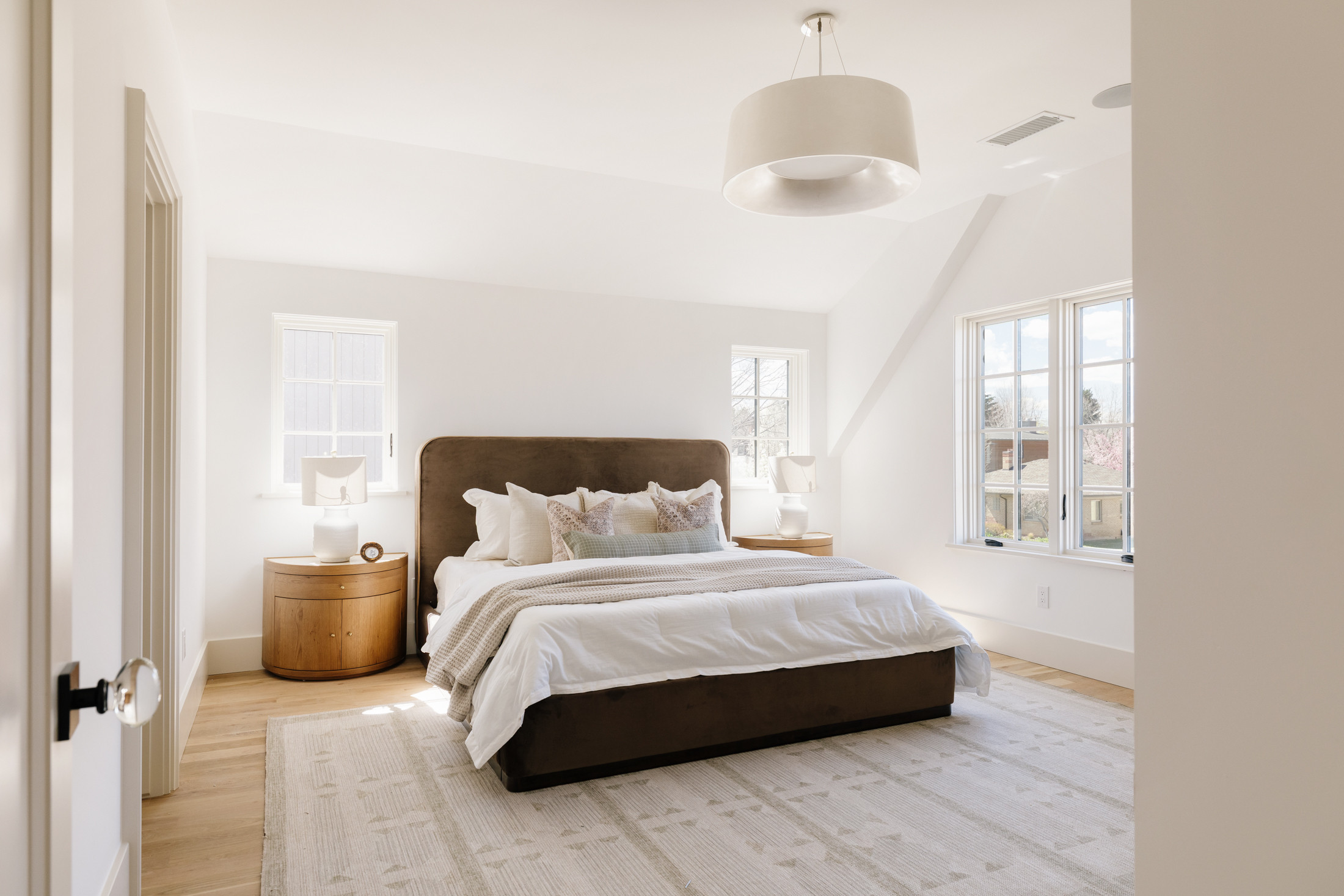 Upholstered brown bed paired with oak and marble nightstands, layered with a soft neutral rug for a warm and refined look.

bedroom, primary, bed, neutral, mcgee and co, pottery barn 

 #LTKHome